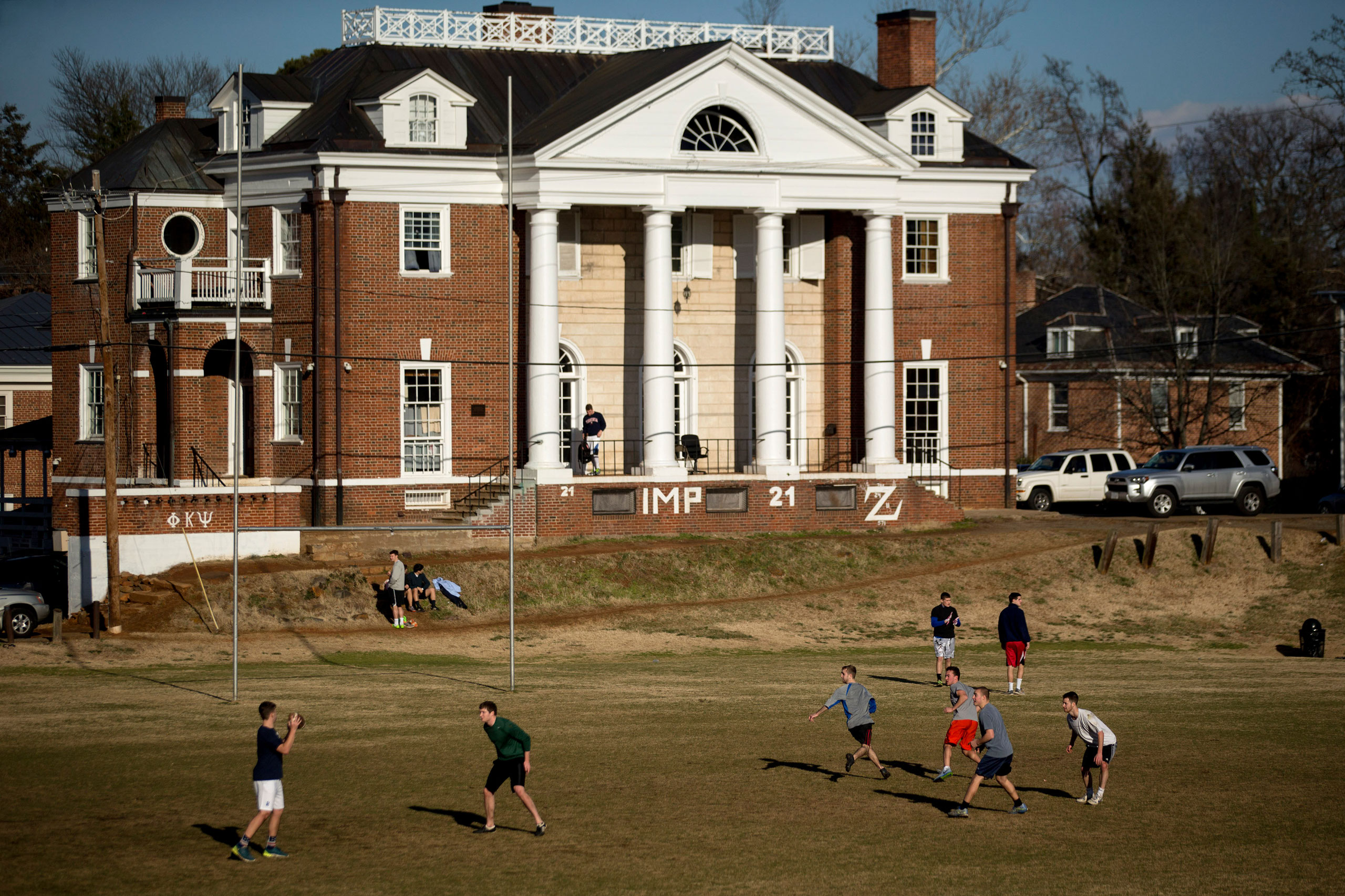 Students play football on the Madison Bowl field of the University of Virginia (UVA) campus next to the Phi Kappa Psi fraternity in Charlottesville, Va., on Jan. 16, 2015.
