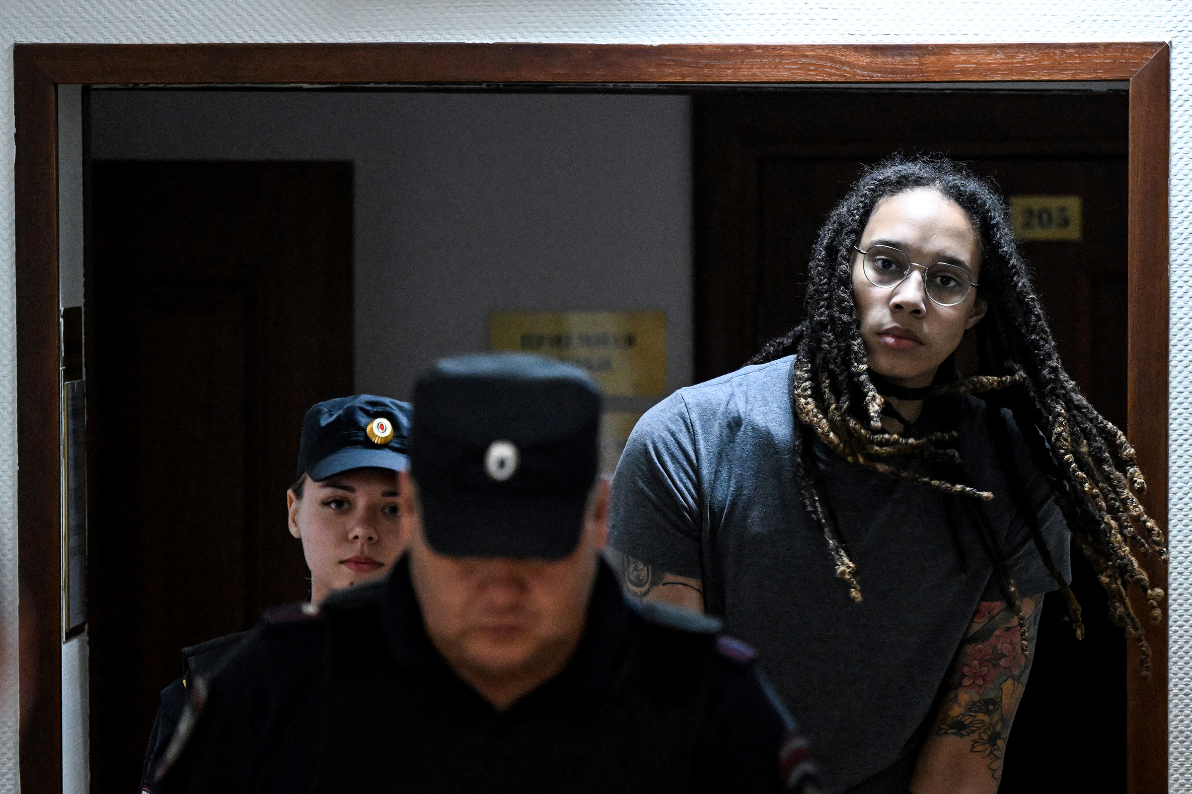 U.S. basketball player Brittney Griner is escorted to hear the court's final decision in Khimki outside Moscow, on Aug. 4.