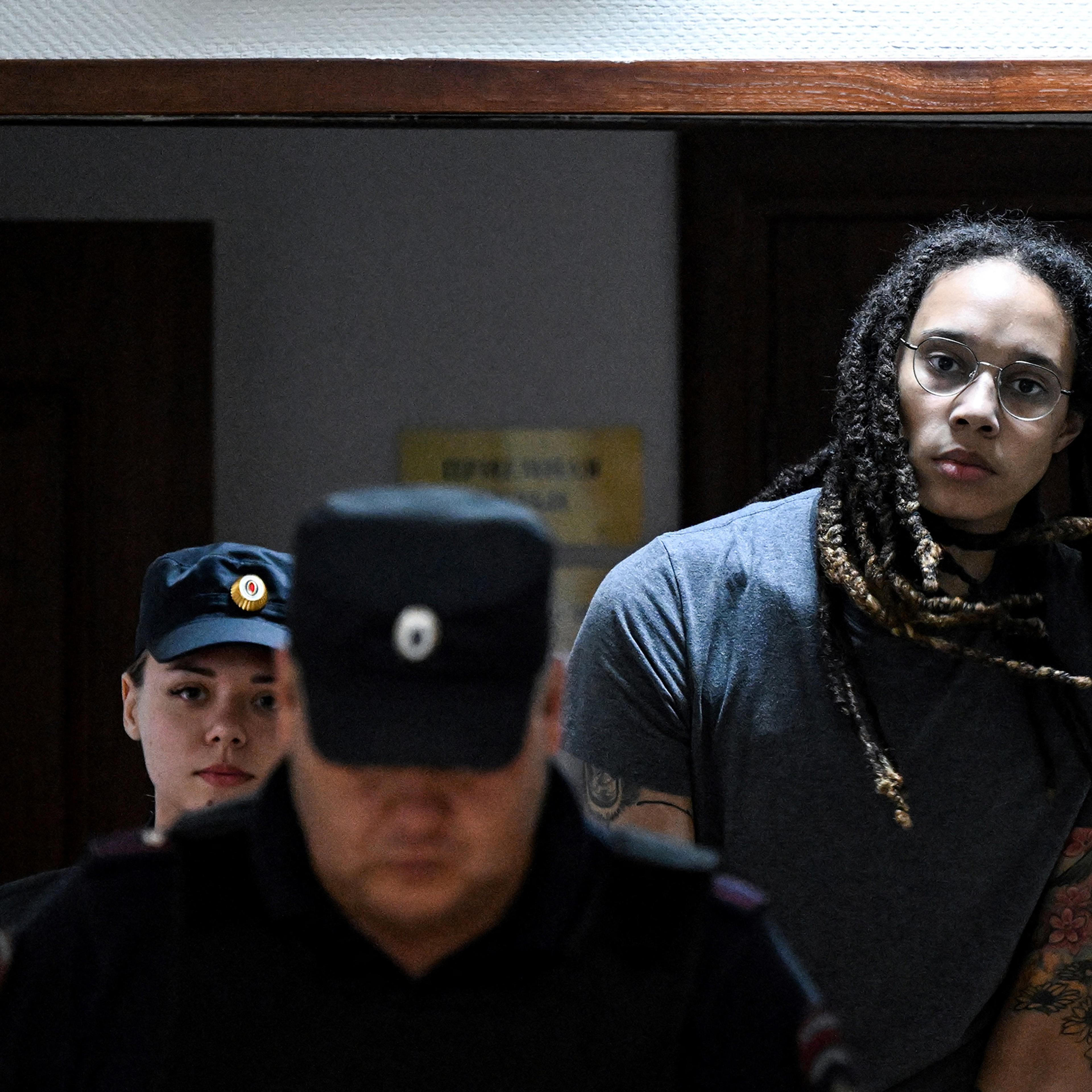 U.S. basketball player Brittney Griner is escorted to hear the court's final decision in Khimki outside Moscow, on Aug. 4.