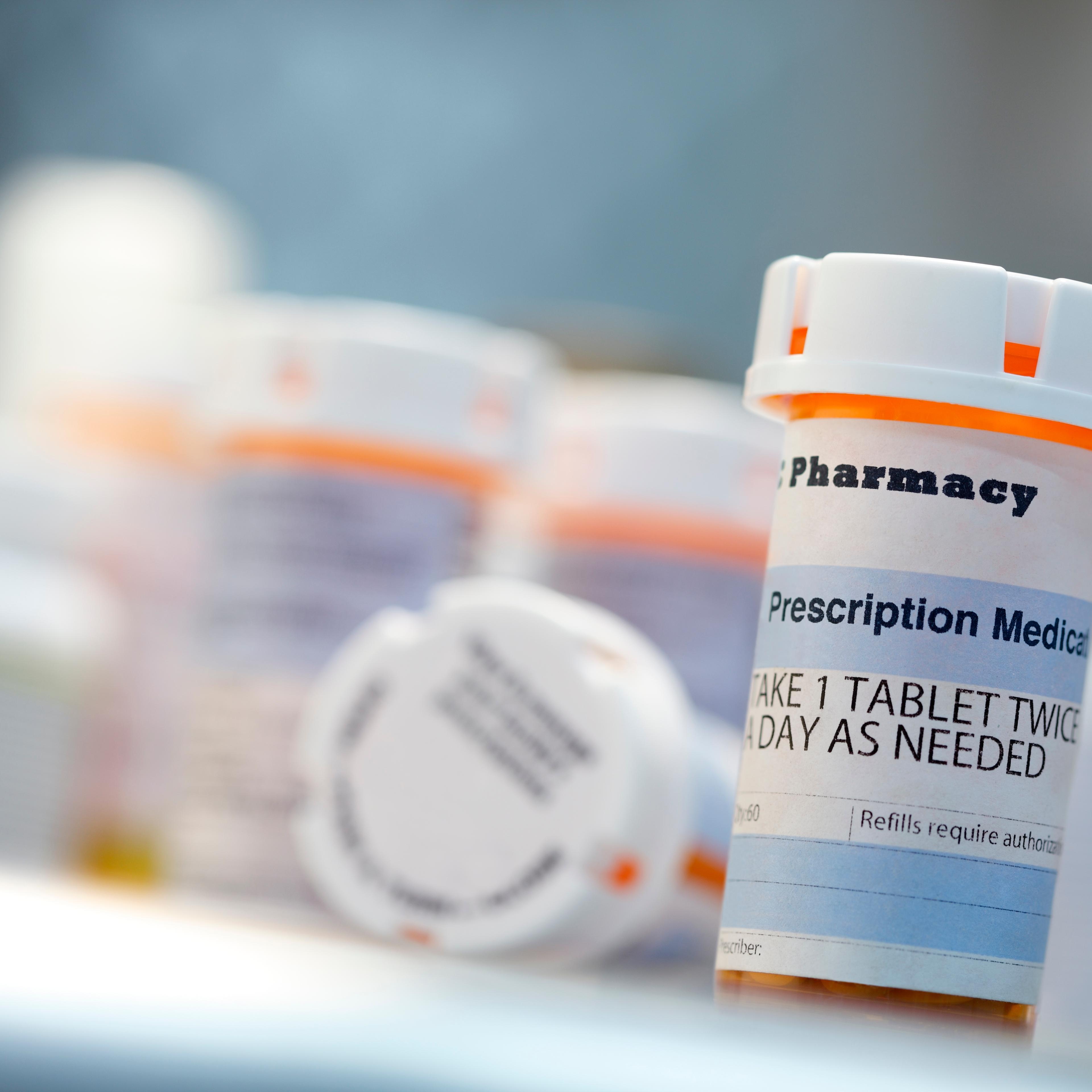 Prescription drug bottles sitting on countertop