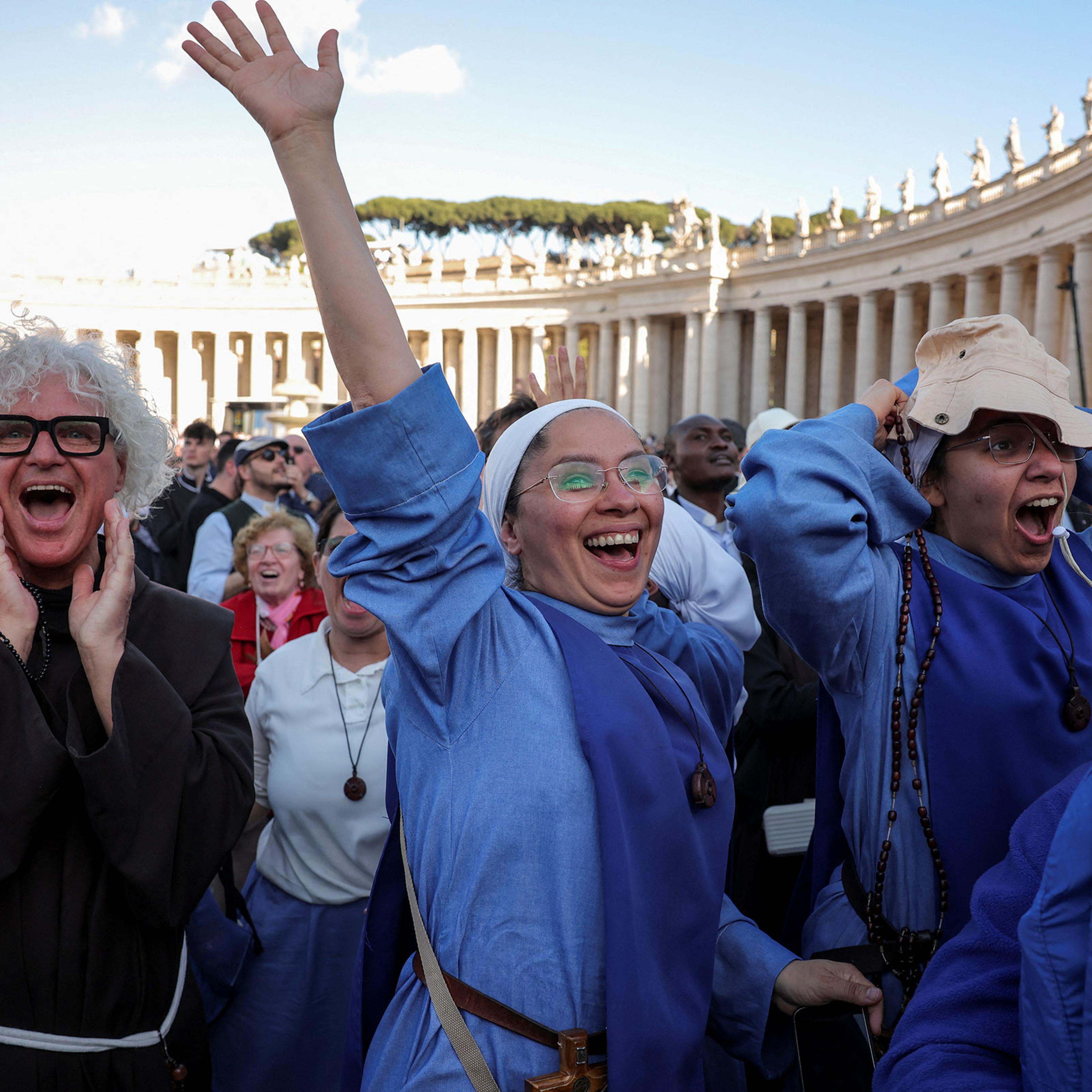 Nuns react to white smoke from the chimney on the Sistine Chapel, indicating that a new pope has been elected, at the Vatican, May 8, 2025.