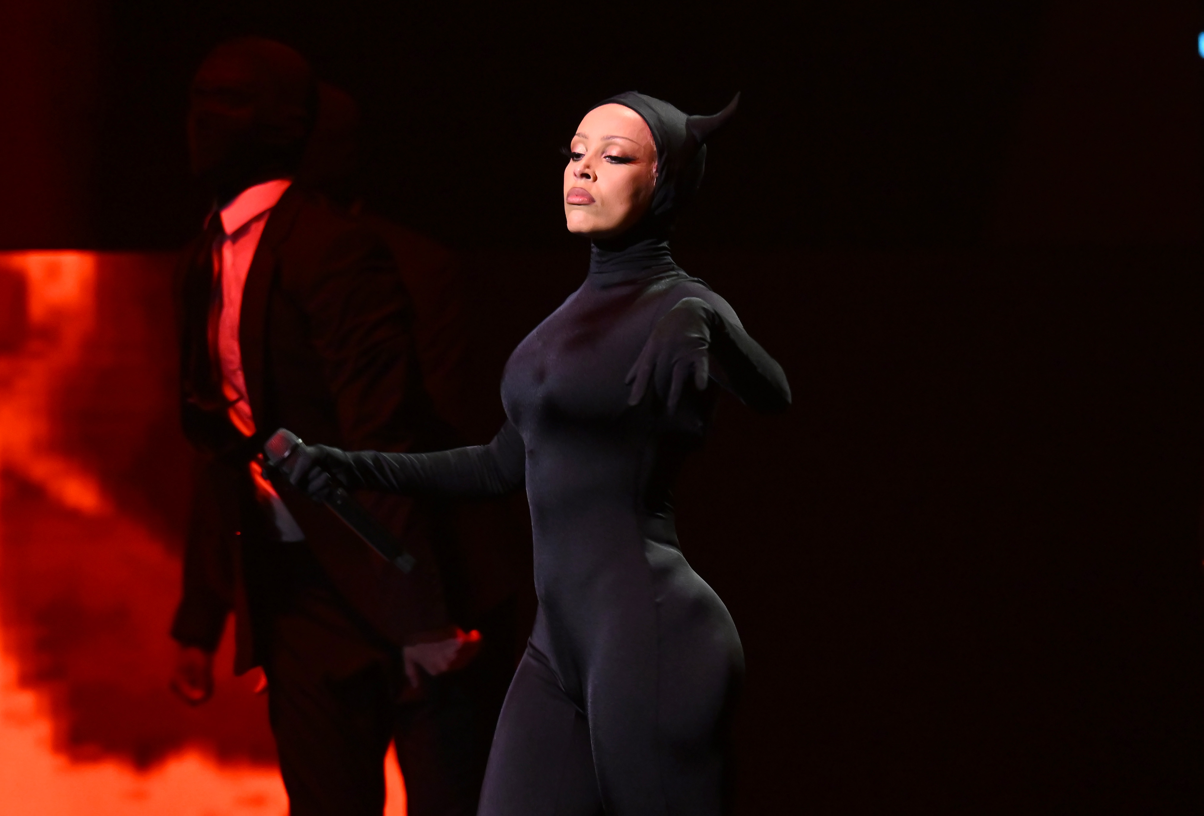 Doja Cat in a black catsuit with horns