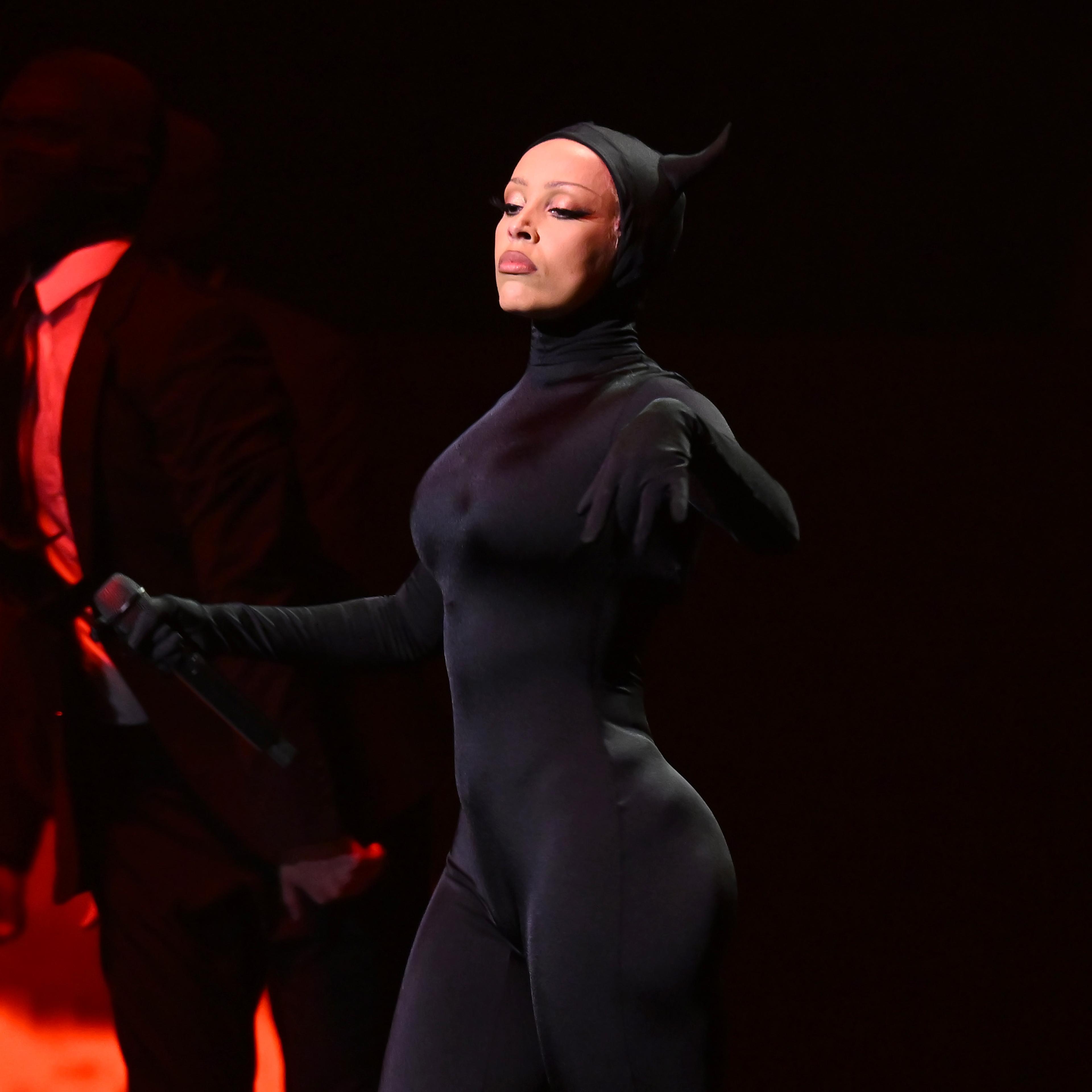 Doja Cat in a black catsuit with horns