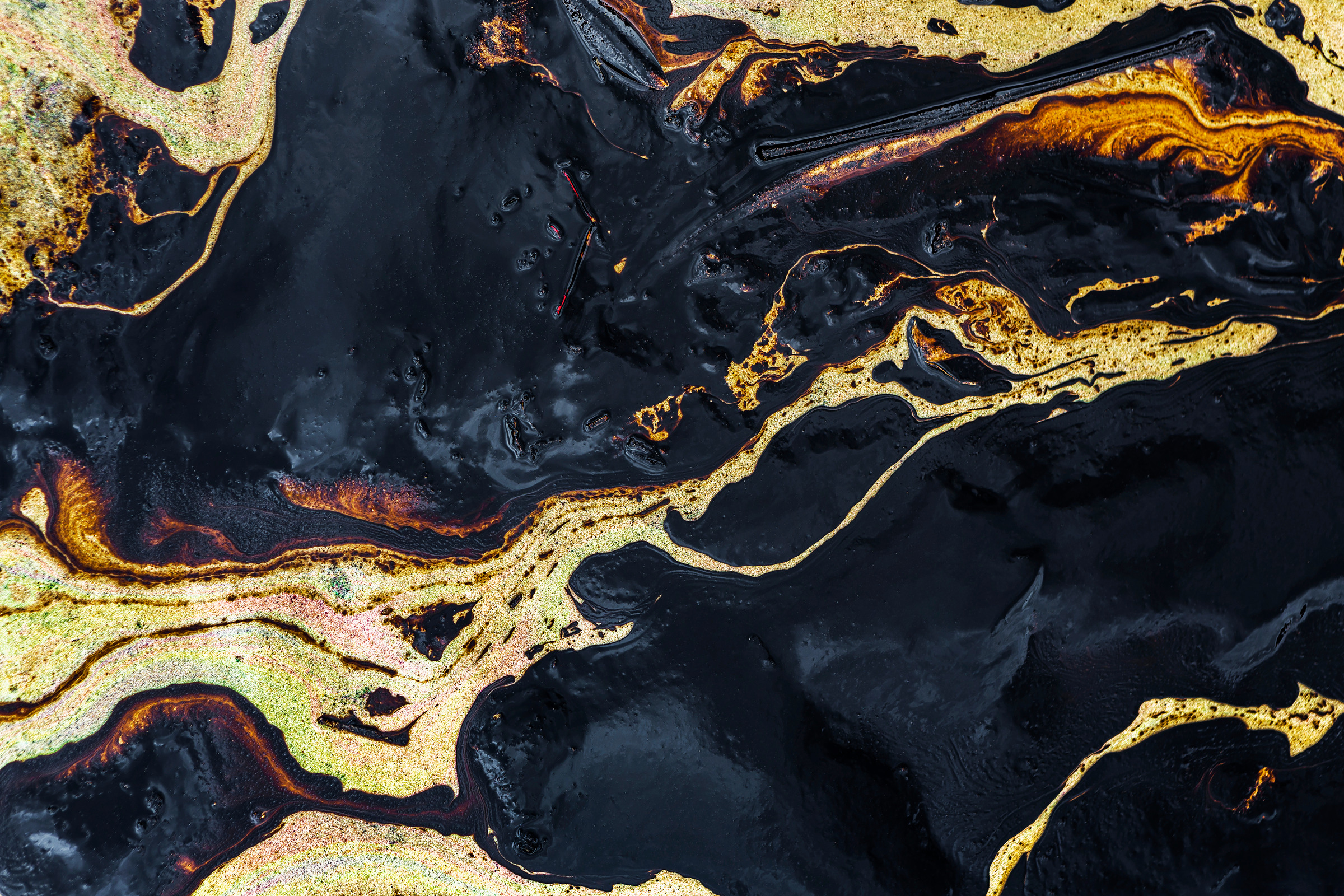 The swirl of an oil slick following a spill in Rayong, Thailand, in 2013.
