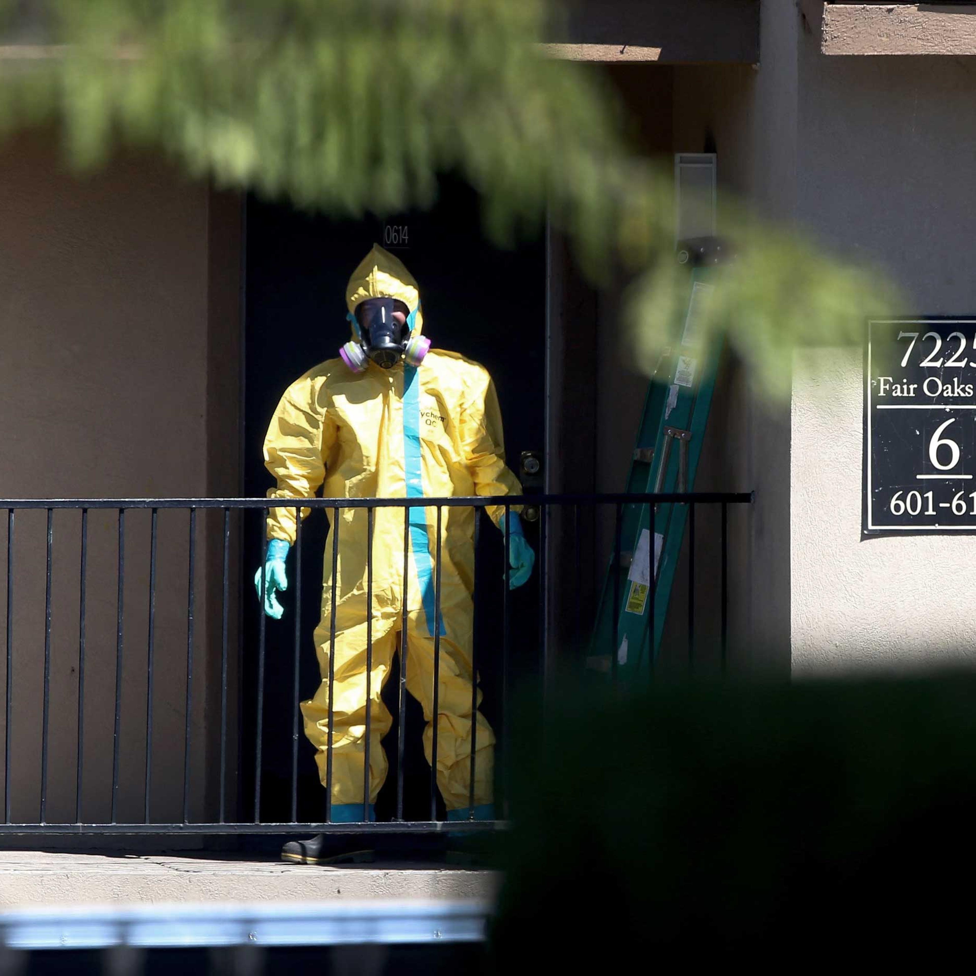 A hazmat team member arrives to clean a unit at the Ivy Apartments, where the confirmed Ebola virus patient was staying, on Oct. 3, 2014 in Dallas, Texas.