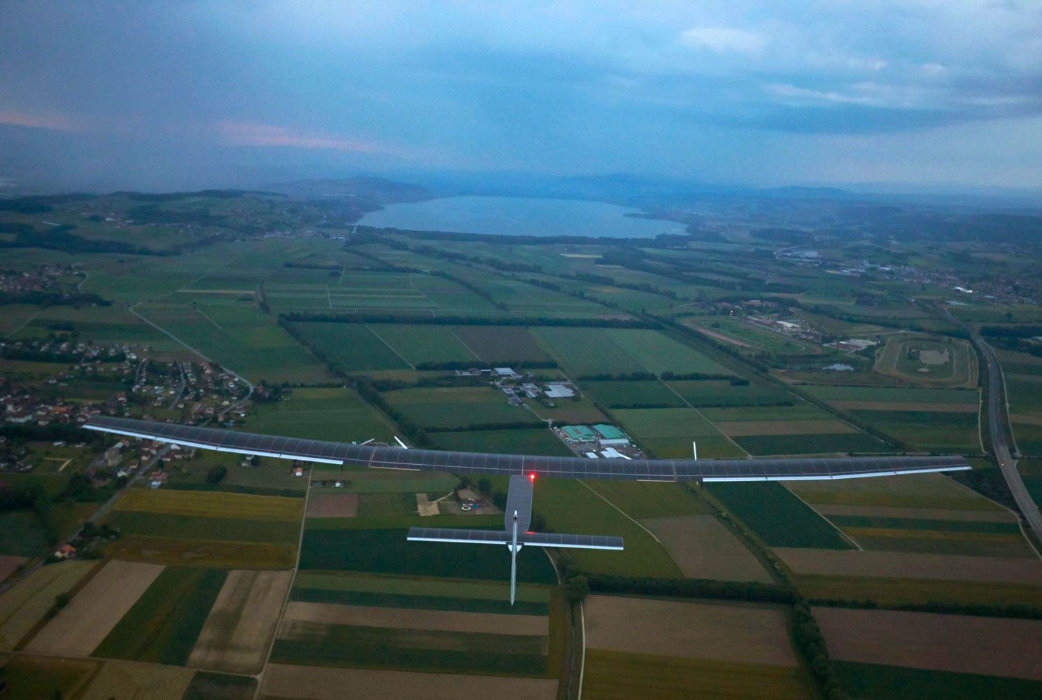 German test pilot Markus Scherdel steers Solar Impulse 2 on its maiden flight from its base in Payerne on June 2, 2014.
