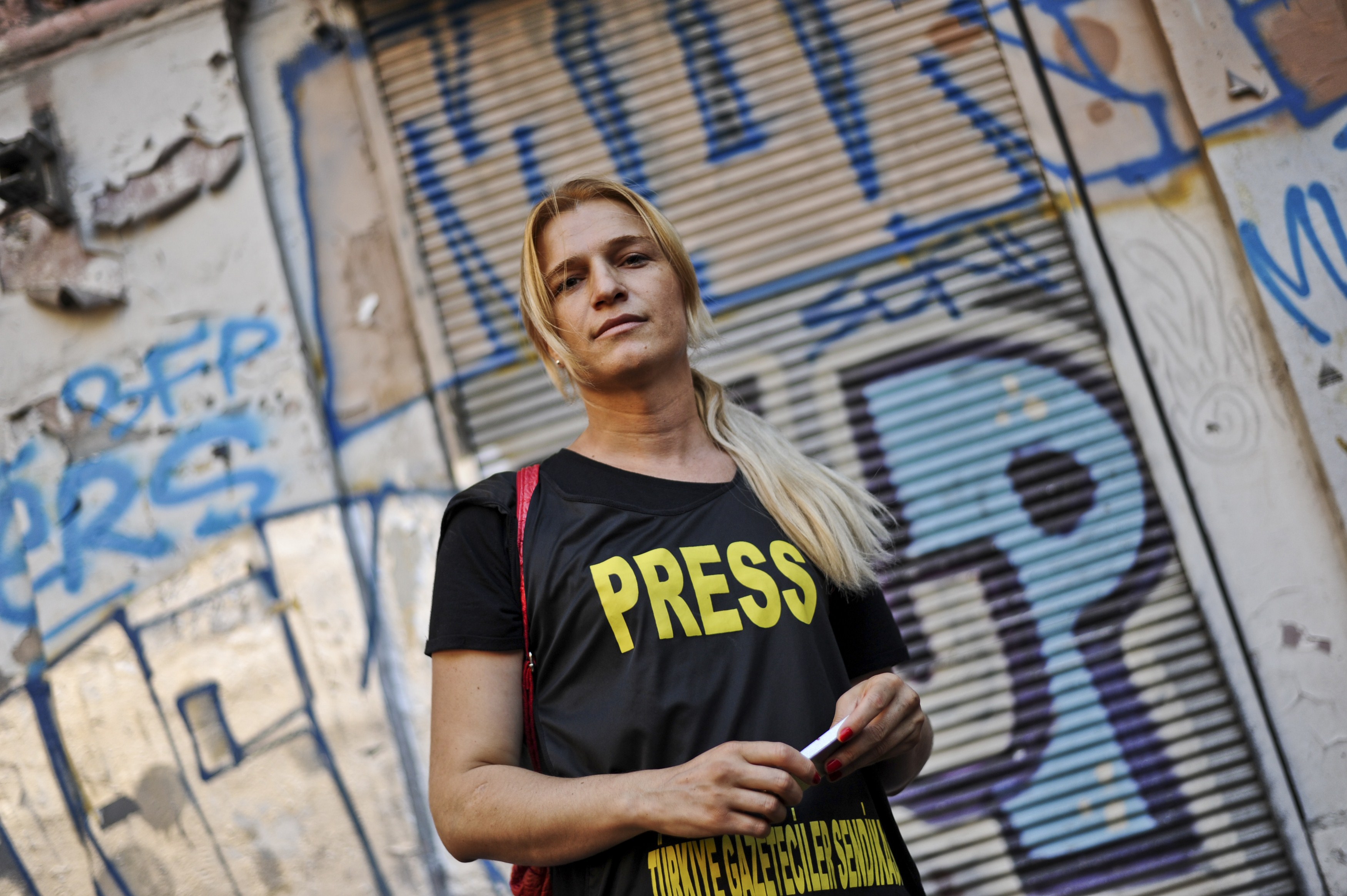 Turkey's first transexual TV reporter Michelle Demishevich attends a gay pride parade on Istiklal Street, Istanbul's main shopping corridor on June 29, 2014, as part of the Trans Pride Week 2014.