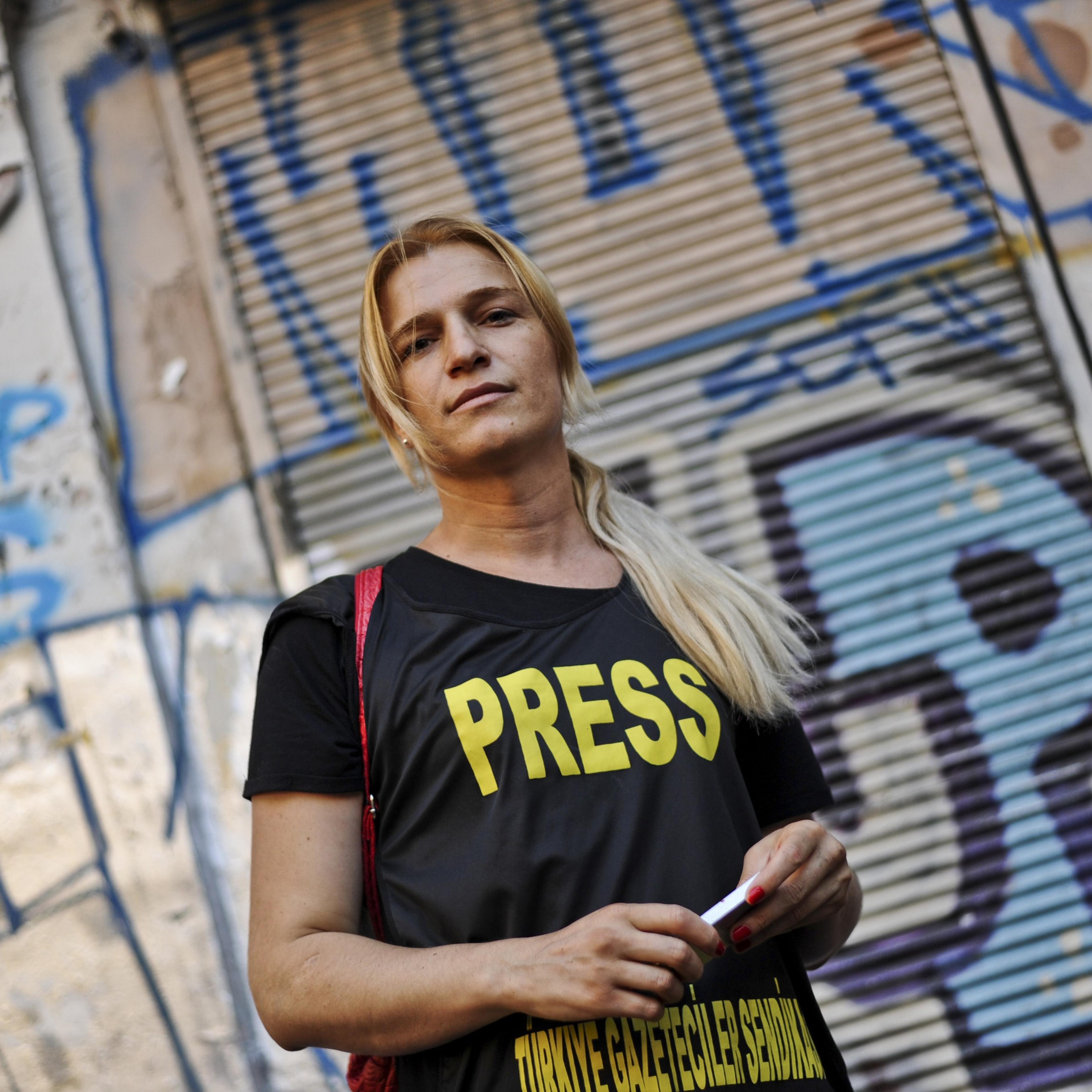 Turkey's first transexual TV reporter Michelle Demishevich attends a gay pride parade on Istiklal Street, Istanbul's main shopping corridor on June 29, 2014, as part of the Trans Pride Week 2014.