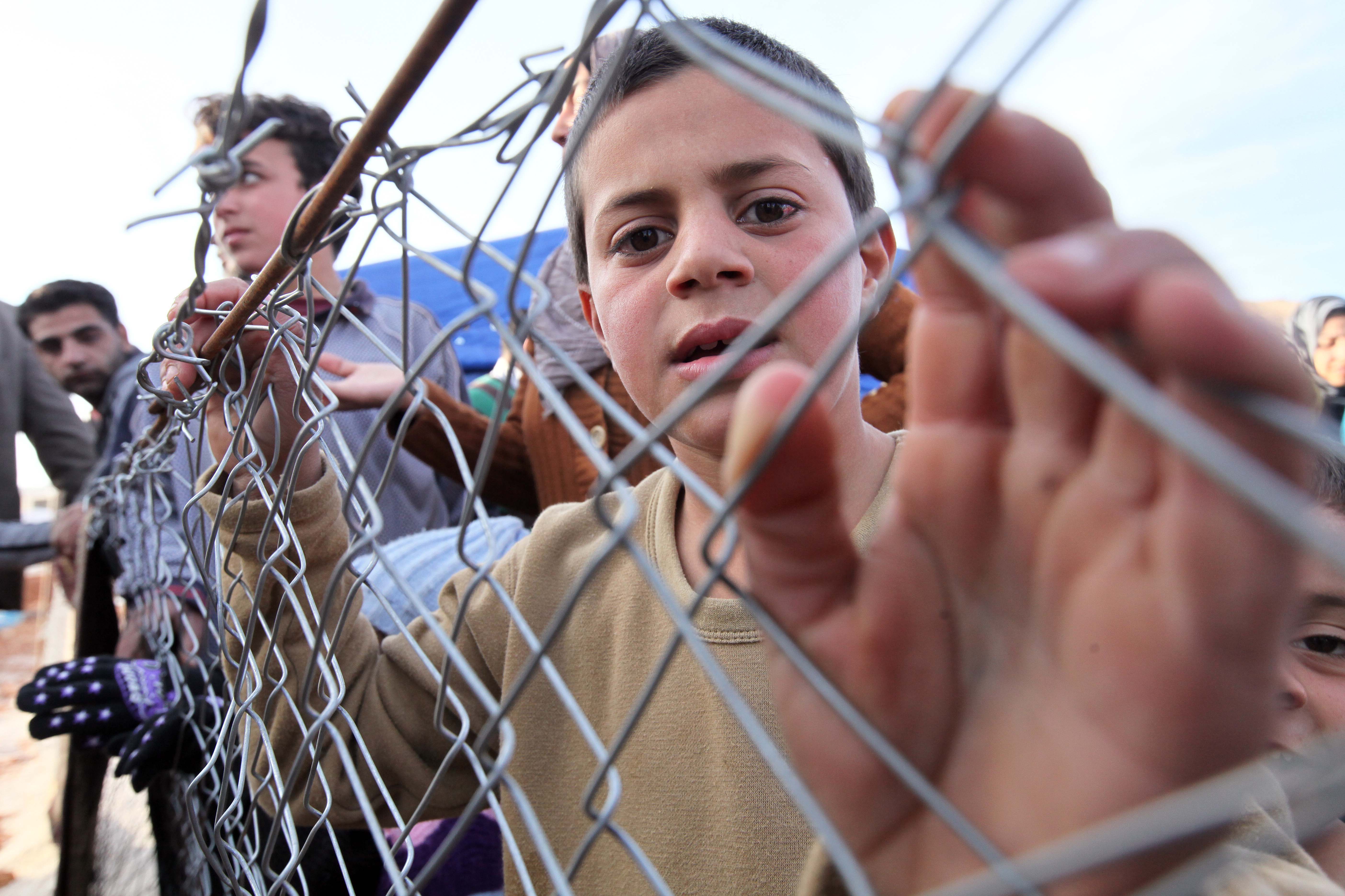 ARSAL, LEBANON - DECEMBER 05:  Syrian refugees fled their homes due to the civil war in their country try to hold on life under tough living conditions at Babel refugee camp in eastern Lebanese city of Arsal on December 05, 2014. Syrian refugees in Leban