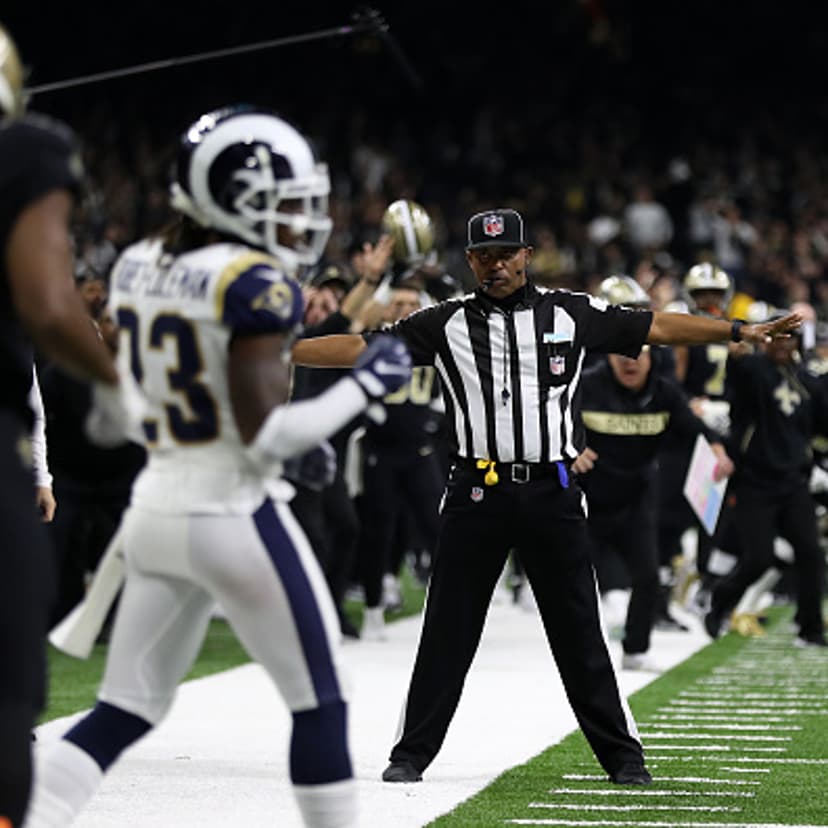 A referee watches as Tommylee Lewis #11 of the New Orleans Saints drops a pass broken up by Nickell Robey-Coleman #23 of the Los Angeles Rams during the fourth quarter in the NFC Championship game at the Mercedes-Benz Superdome on January 20, 2019 in New