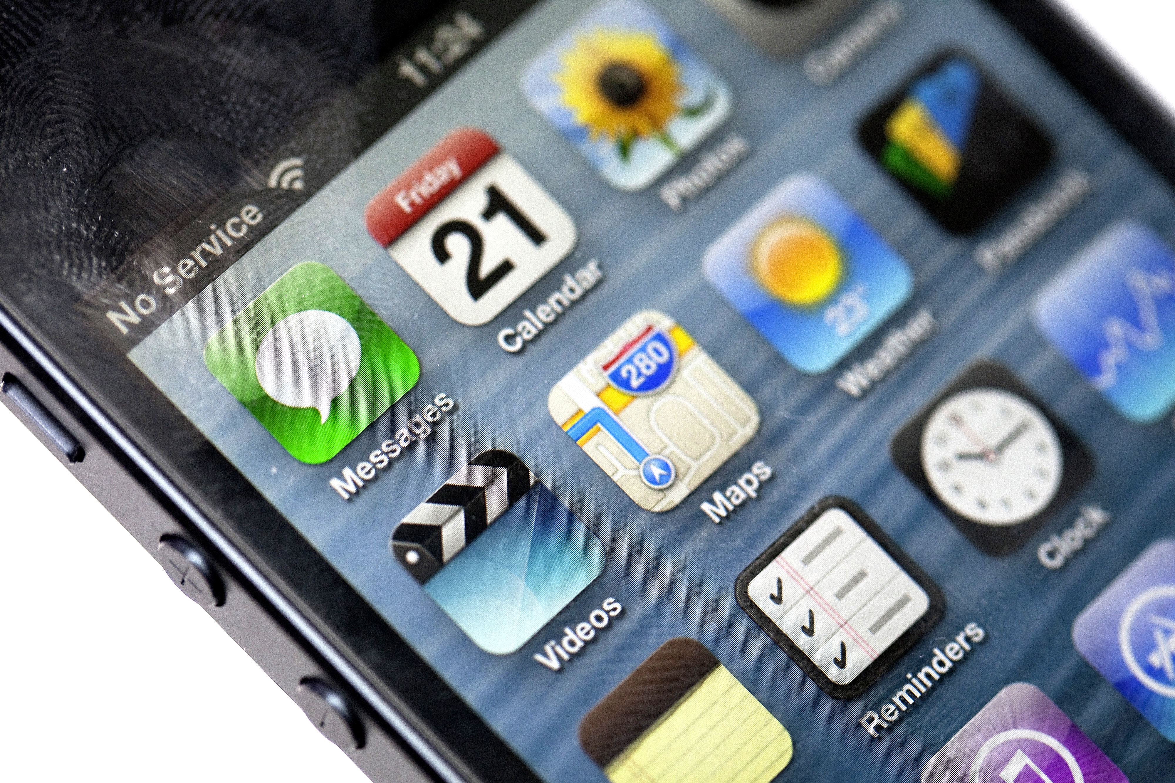 The new Apple Inc. Maps app icon is seen on an Apple Inc. iPhone 5 in this arranged photograph in London, U.K., on Friday, Sept. 21, 2012.