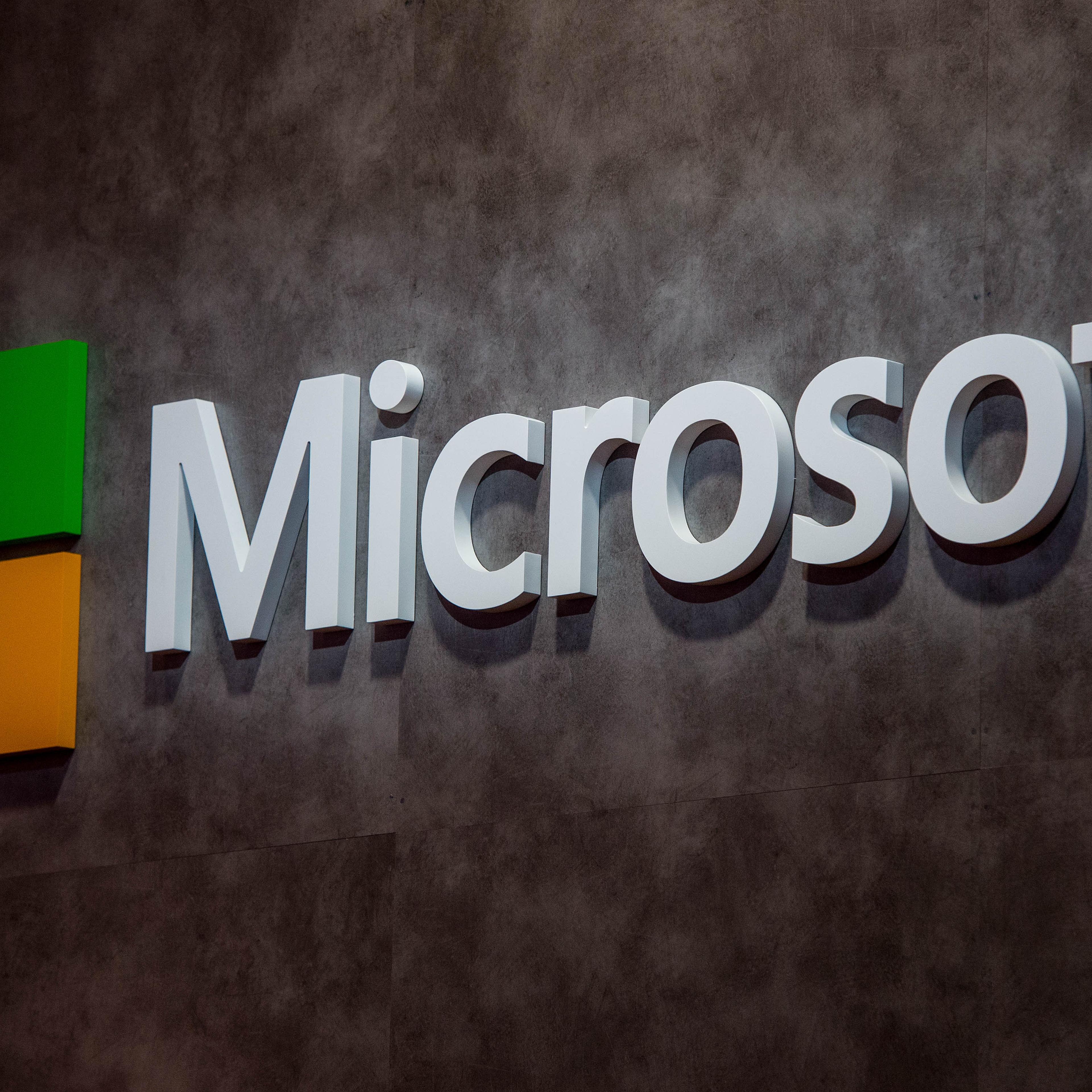 A logo sits illuminated outside the Microsoft pavilion on the opening day of the World Mobile Congress at the Fira Gran Via Complex on February 22, 2016 in Barcelona, Spain.
