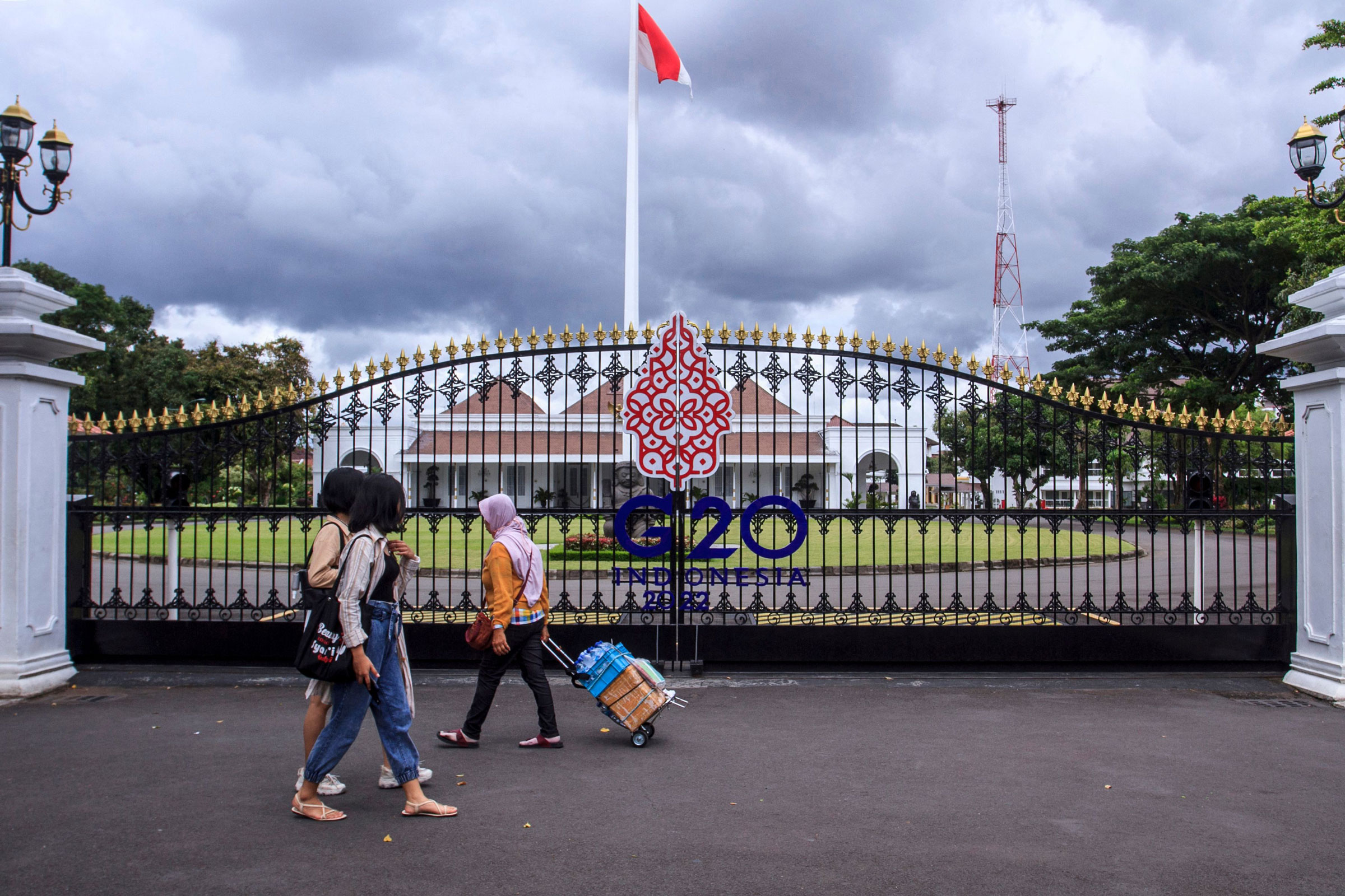 People walk by the main gate of the Kraton, also known as the Palace of Yogyakarta, in Yogyakarta on Oct. 30, 2022