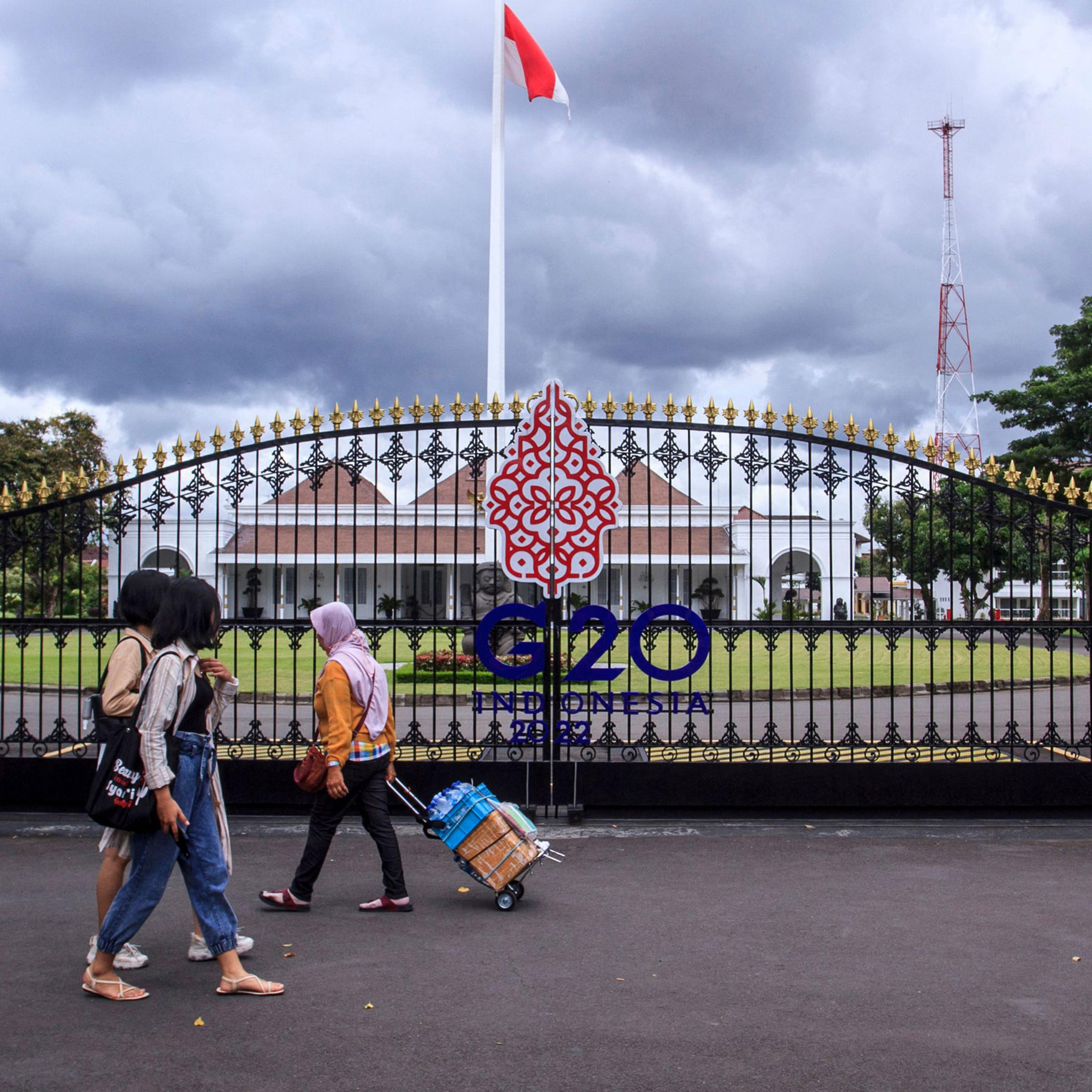 People walk by the main gate of the Kraton, also known as the Palace of Yogyakarta, in Yogyakarta on Oct. 30, 2022