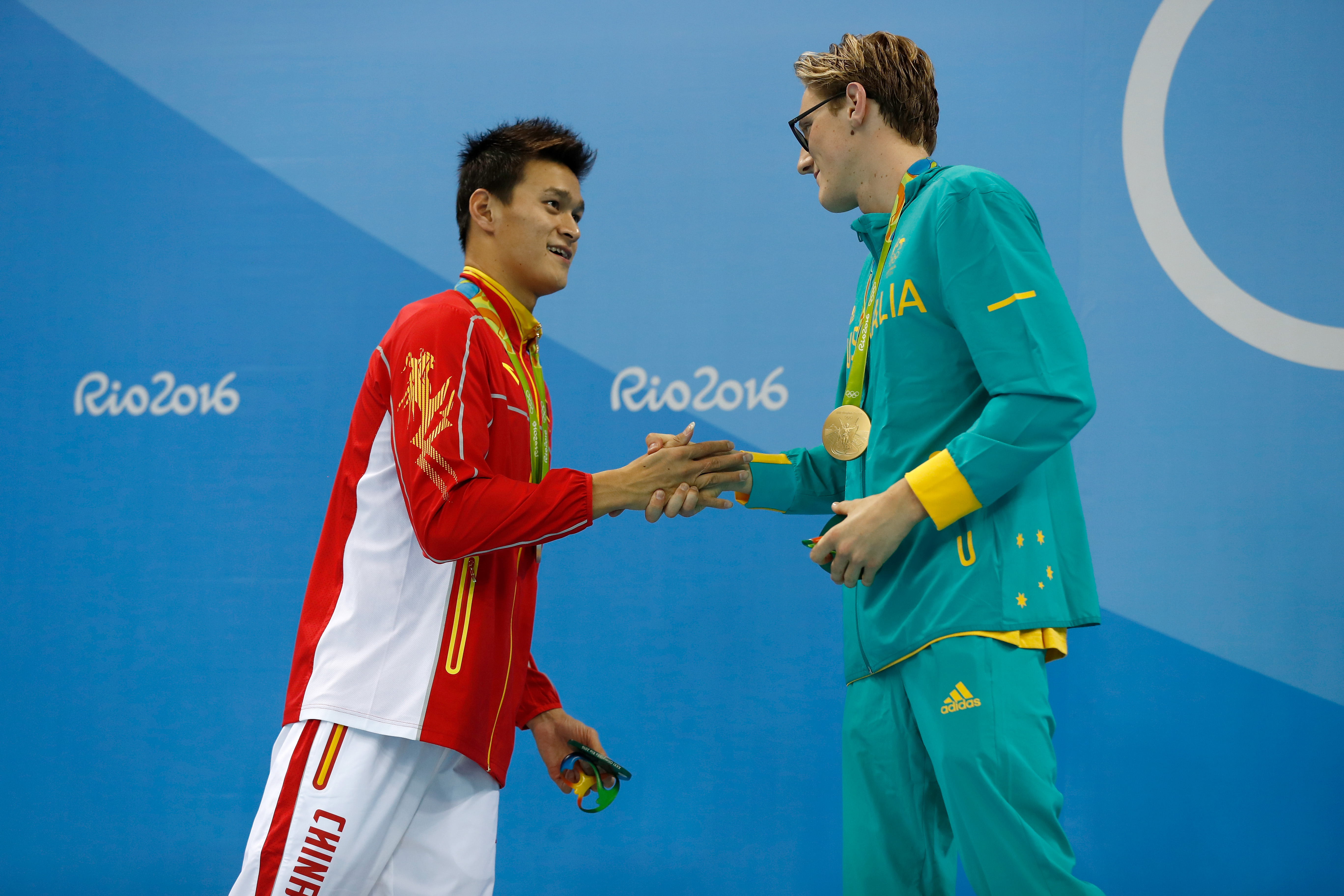 (L-R) Silver medalist Sun Yang of China and gold medal medallist Mack Horton of Australia pose during the medal ceremony for the Final of the Men's 400m Freestyle on Day 1 of the Rio 2016 Olympic Games at the Olympic Aquatics Stadium on August 6, 2016 in