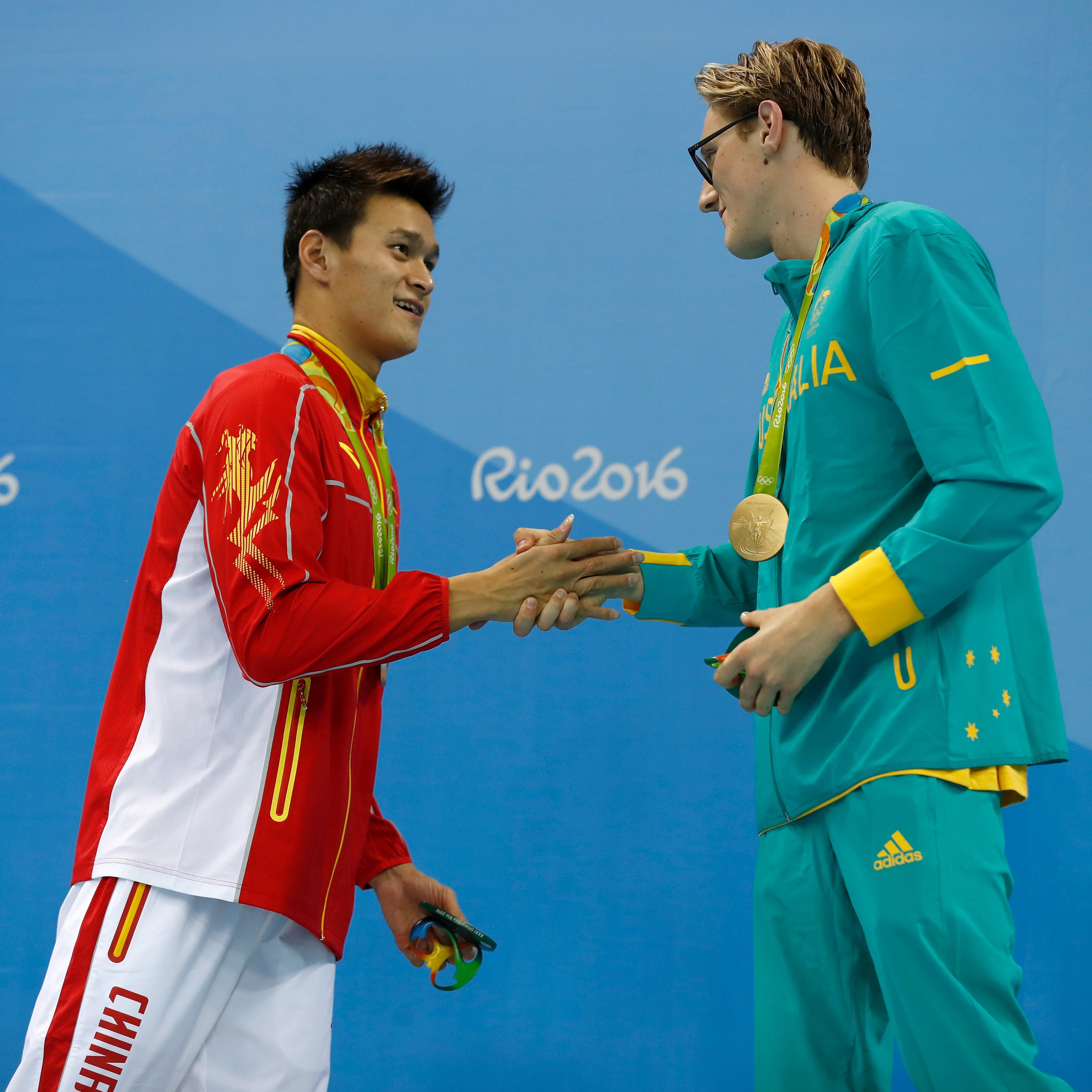 (L-R) Silver medalist Sun Yang of China and gold medal medallist Mack Horton of Australia pose during the medal ceremony for the Final of the Men's 400m Freestyle on Day 1 of the Rio 2016 Olympic Games at the Olympic Aquatics Stadium on August 6, 2016 in