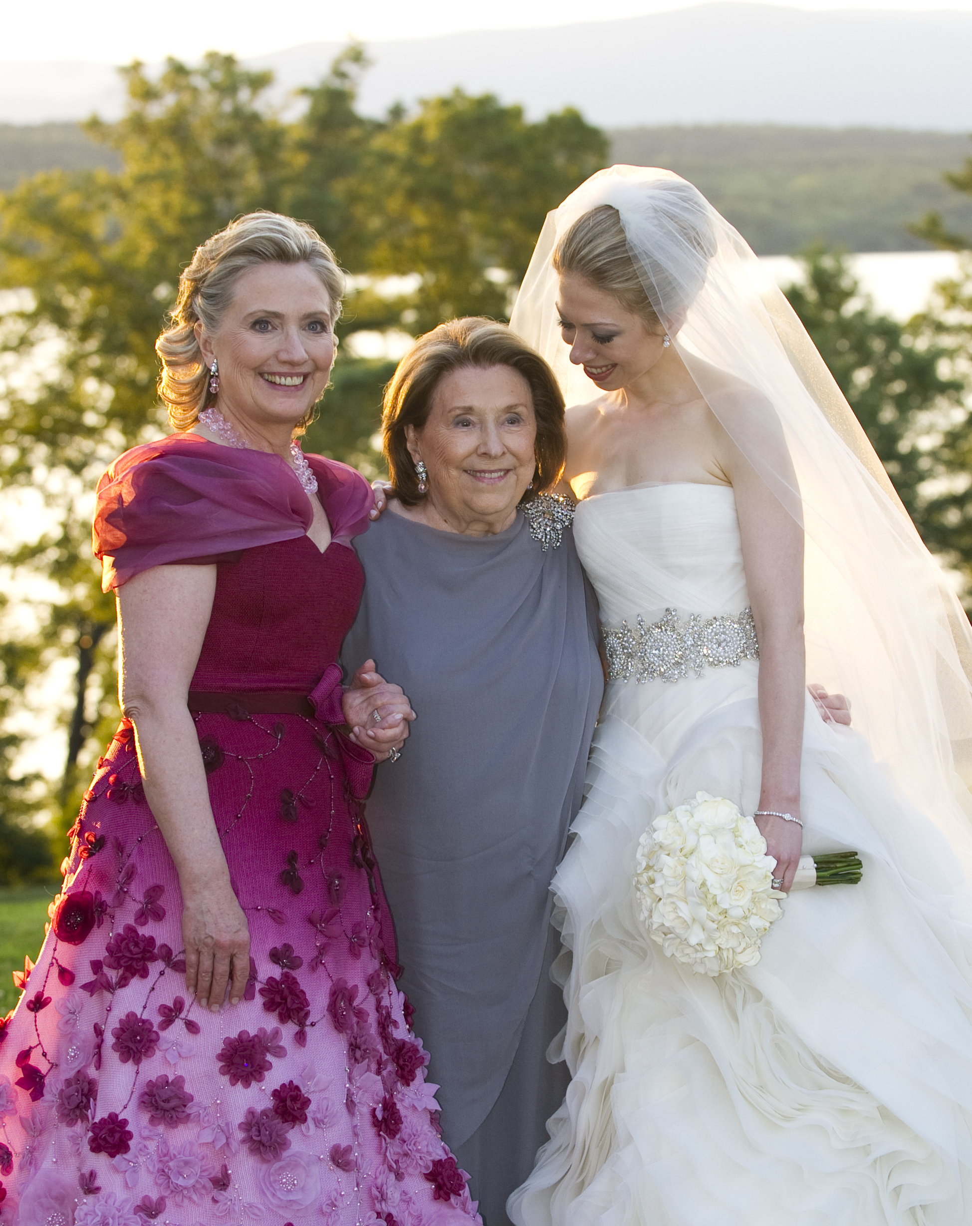 In this handout image provided by Barbara Kinney, (L-R) U.S. Secretary of State Hillary Clinton, her mother Dorothy Rodham and Chelsea Clinton pose during the wedding of Chelsea Clinton and Marc Mezvinsky at the Astor Courts Estate in Rhinebeck, N.Y., on
