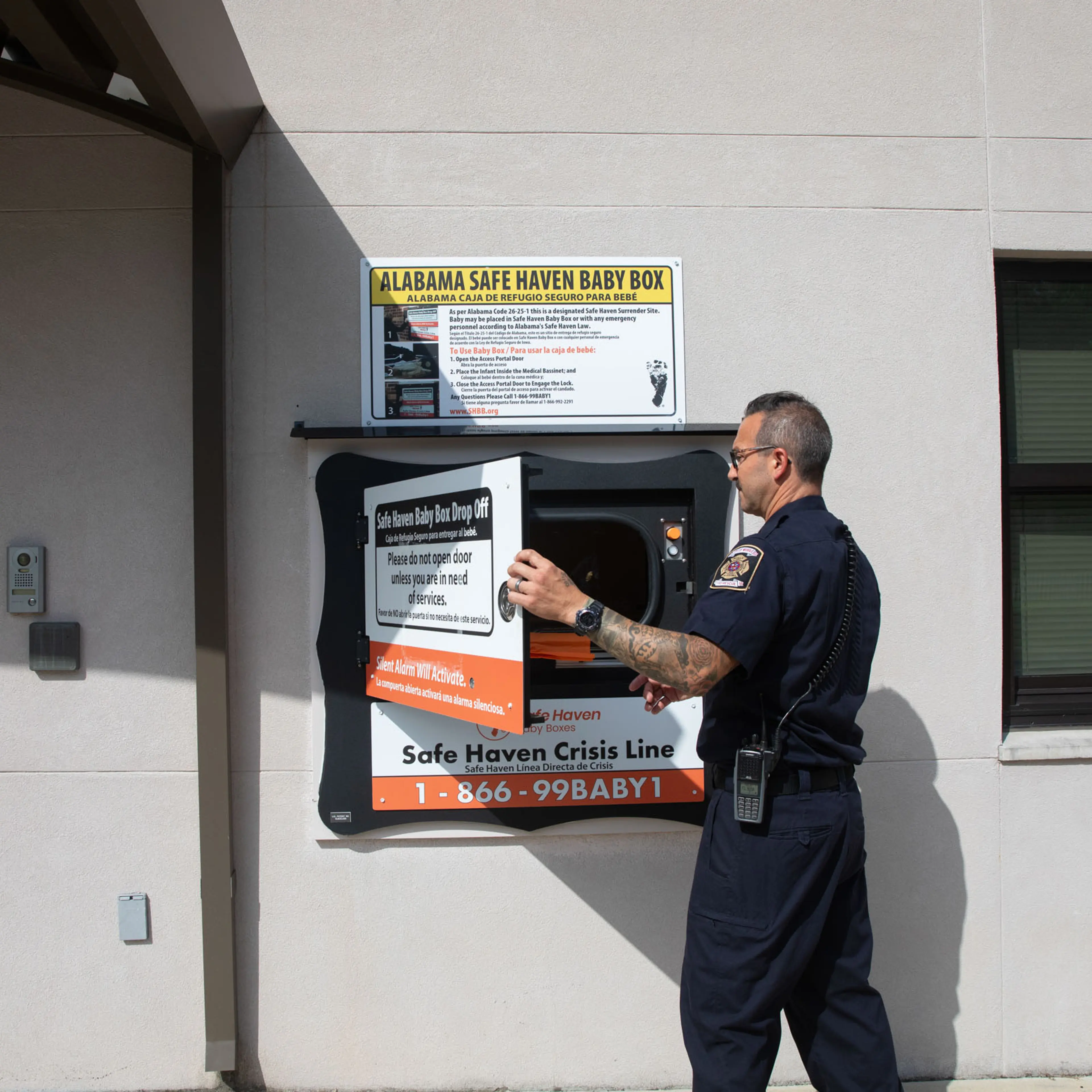 Engine 12 Captain Mike Allen opens the door to a Safe Haven Baby Box at a Mobile Fire Station No. 12 in Mobile Alabama on June 9th, 2025.