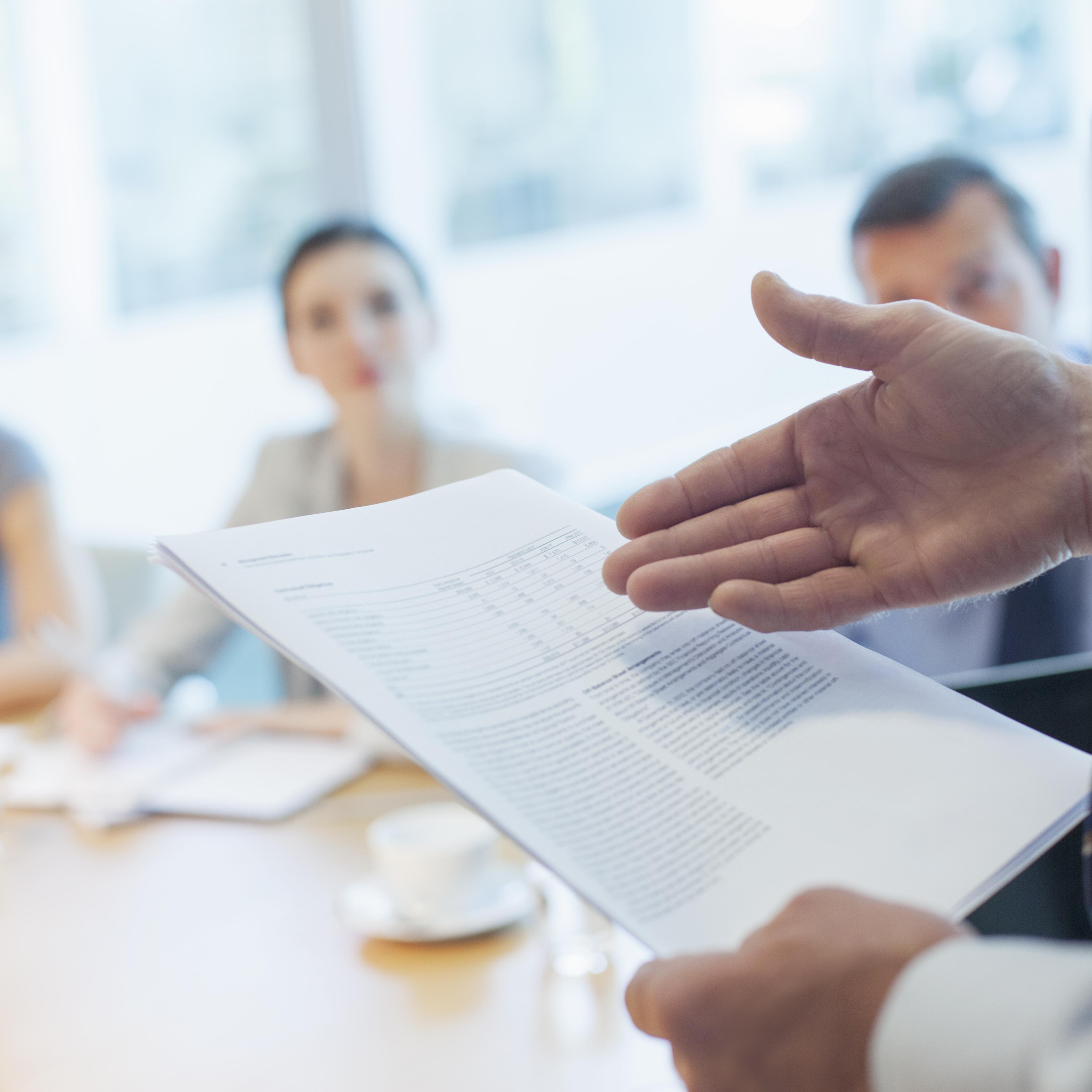 Businessman leading meeting in conference room