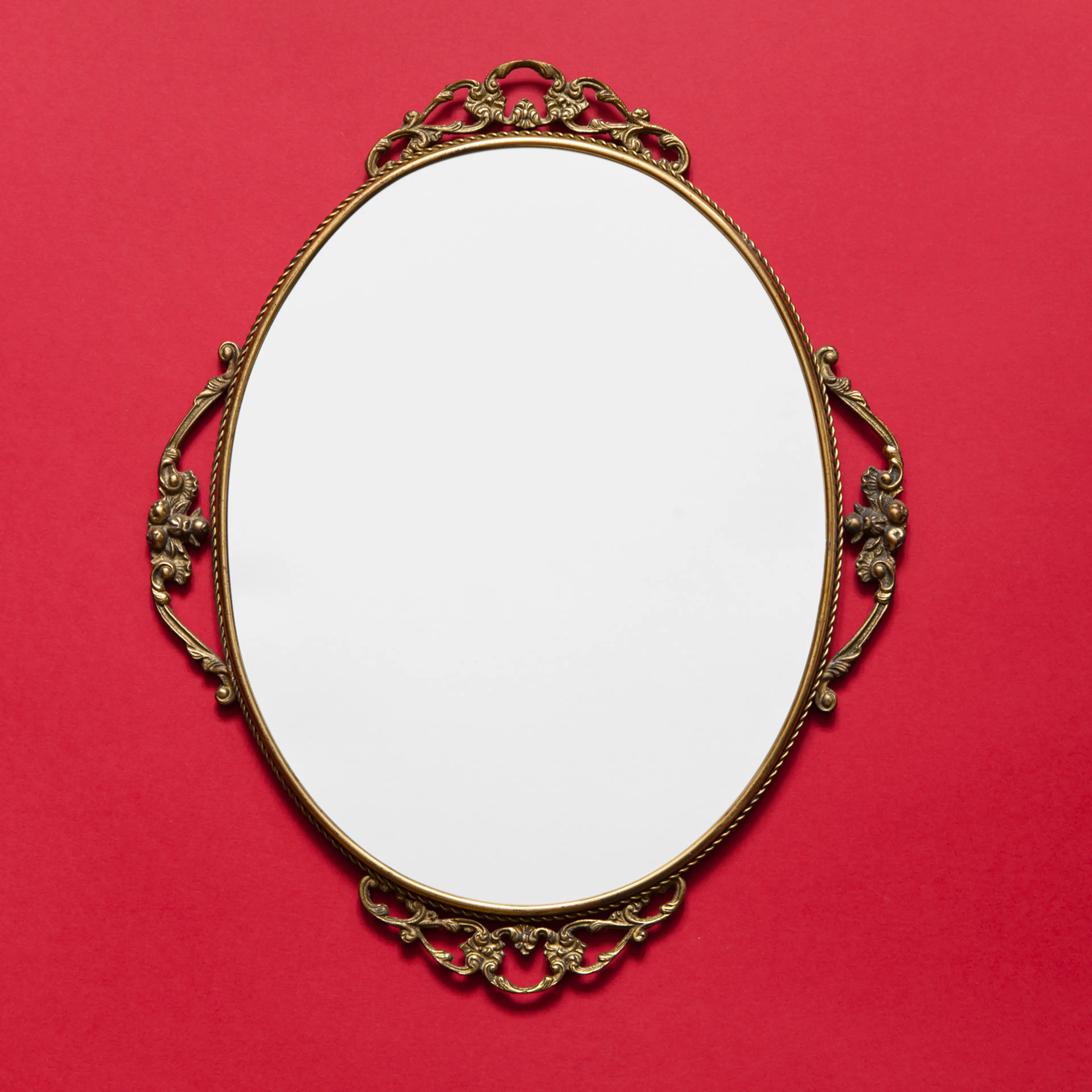 Golden Oval frame on red background