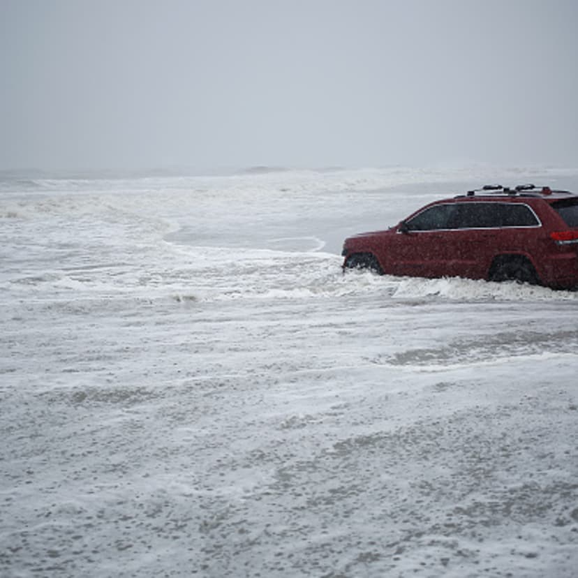 A Jeep Grand Cherokee sits stranded on a beach during Hurricane Dorian in Myrtle Beach, South Carolina, on Thursday, Sept. 5, 2019.