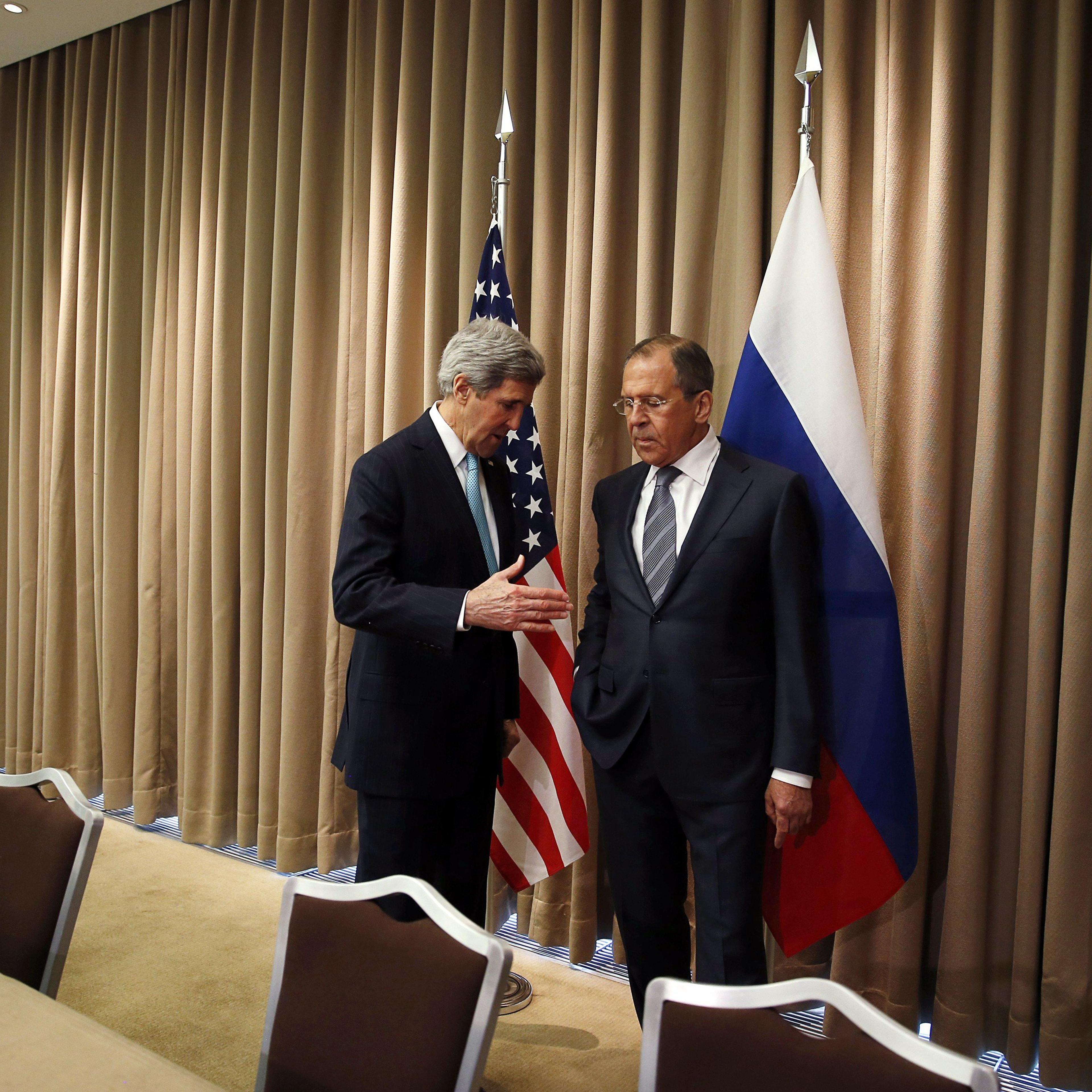 From left: U.S. Secretary of State John Kerry talks with Russian Foreign minister Sergei Lavrov at the start of a bilateral meeting to discuss the ongoing situation in Ukraine on April 17, 2014 in Geneva.
