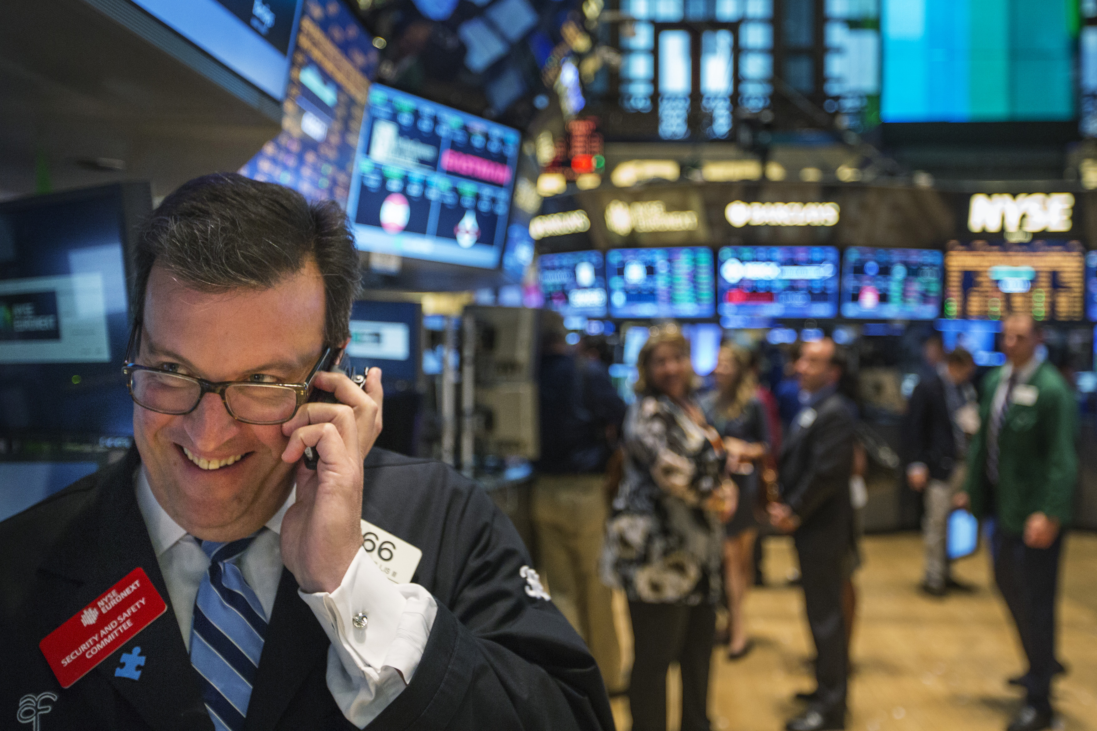 A trader works on the floor of the New York Stock Exchange shortly before the end of the day's trading in New York July 31, 2013