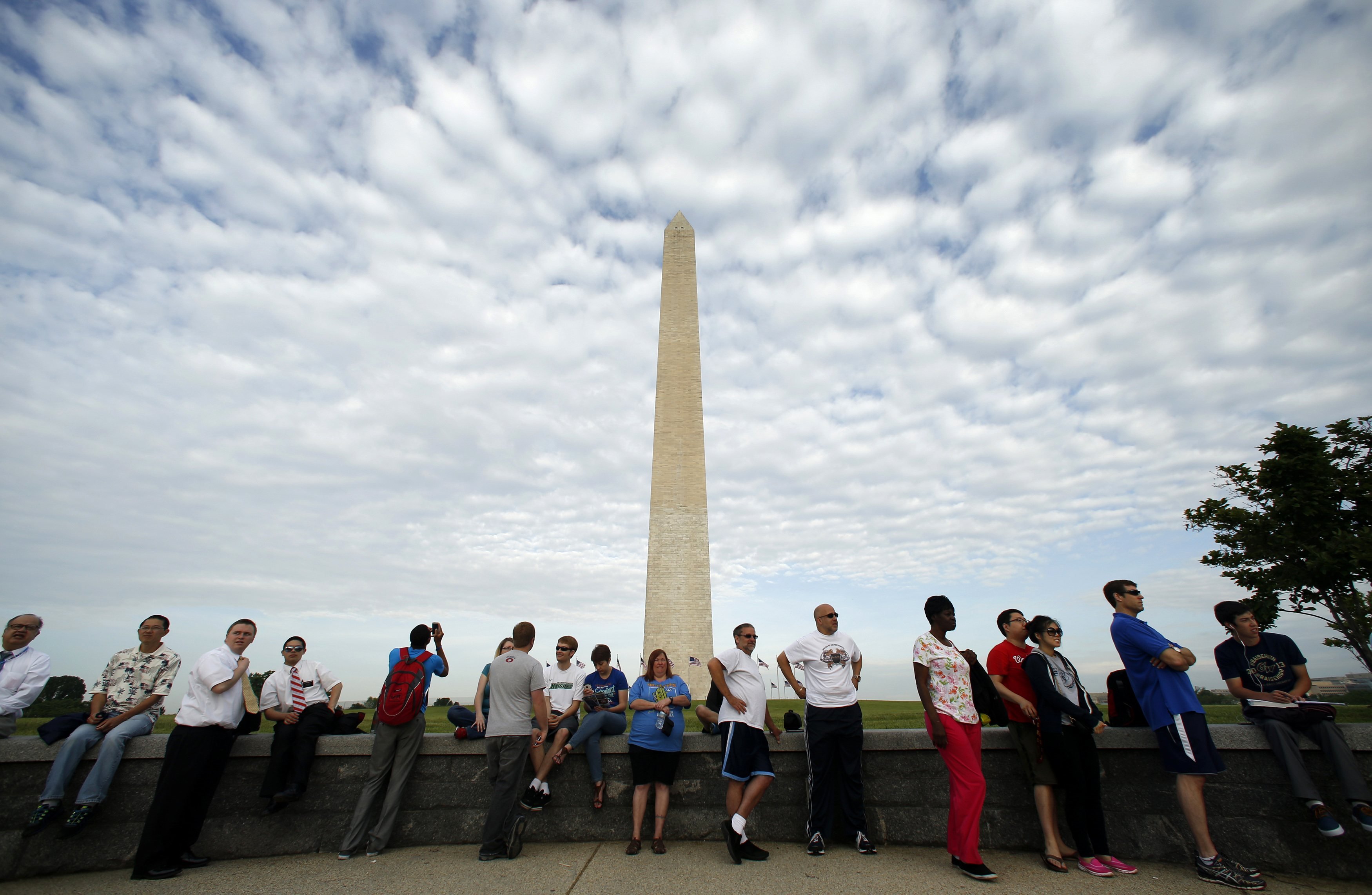 The very first visitors in line wait to purchase tickets to the re-opened Washington Monument in Washington, D.C., on May 12, 2014.