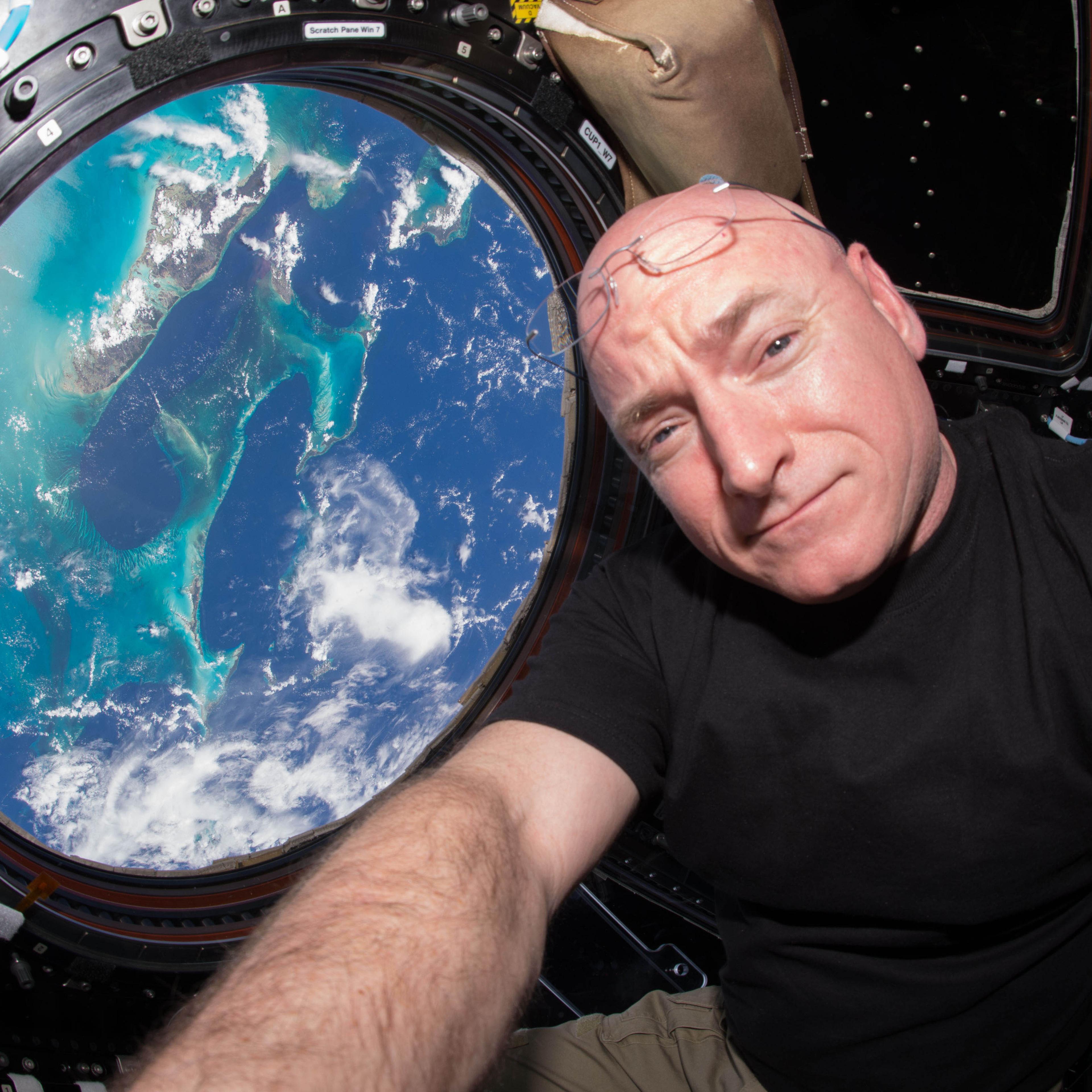 Scott Kelly poses for a selfie photo in the "Cupola" of the International Space Station.
