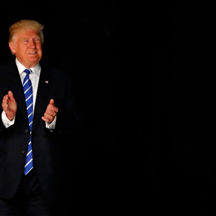 DALLAS, TX - JUNE 16: Republican presidential candidate Donald Trump arrives on stage June 16, 2016 at Gilley's in Dallas, Texas. Trump arrived in Texas on Thursday with plans to hold rallies and fundraisers. (Photo by Ron Jenkins/Getty Images)