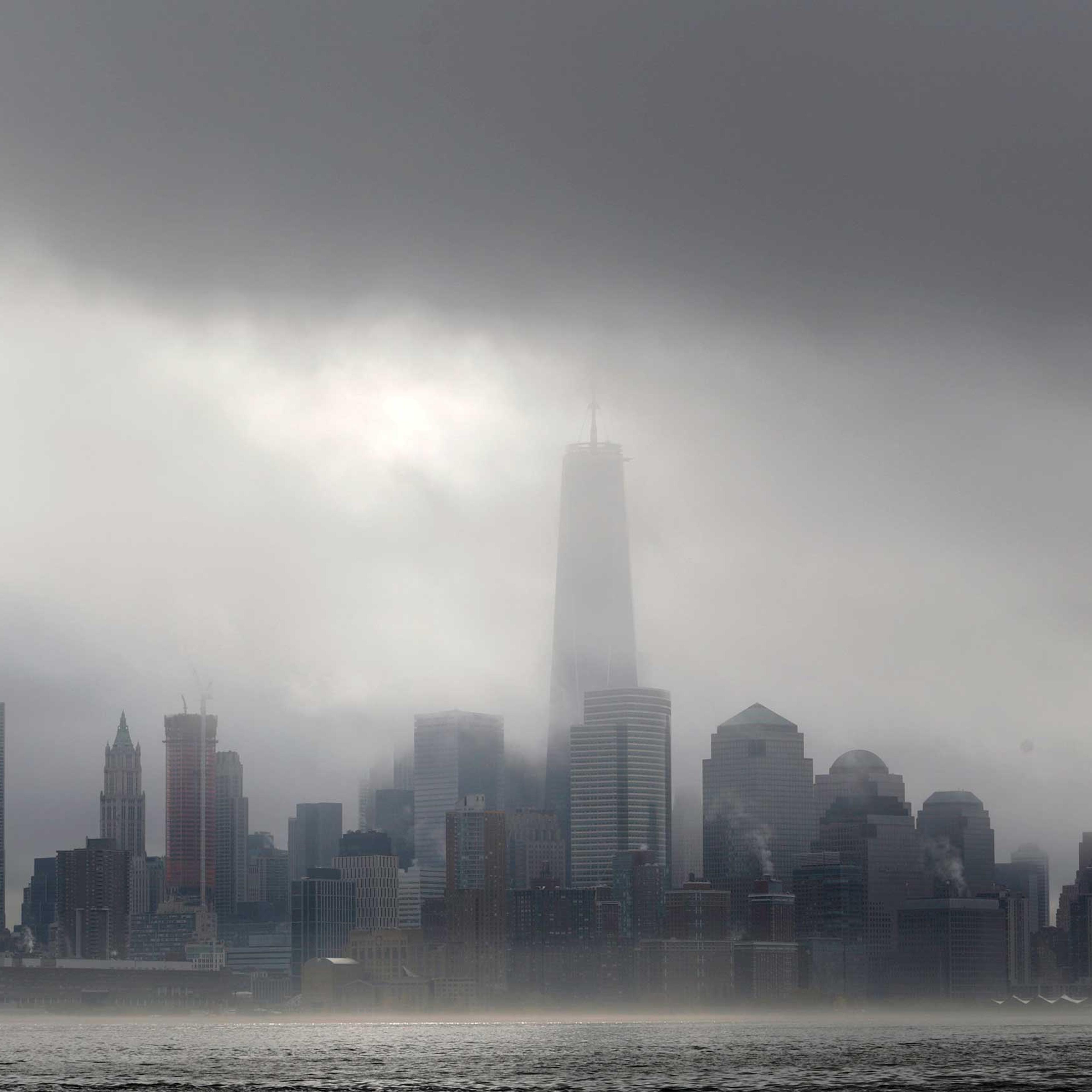 Heavy fog blankets lower Manhattan in New York, including One World Trade Center, center, in this view across the Hudson River from Hoboken, N.J., Nov. 12, 2014.