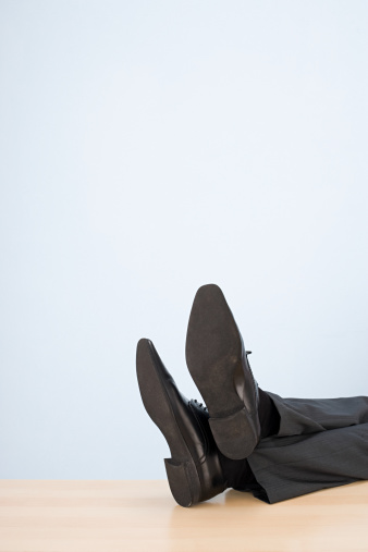 businessman-feet-desk