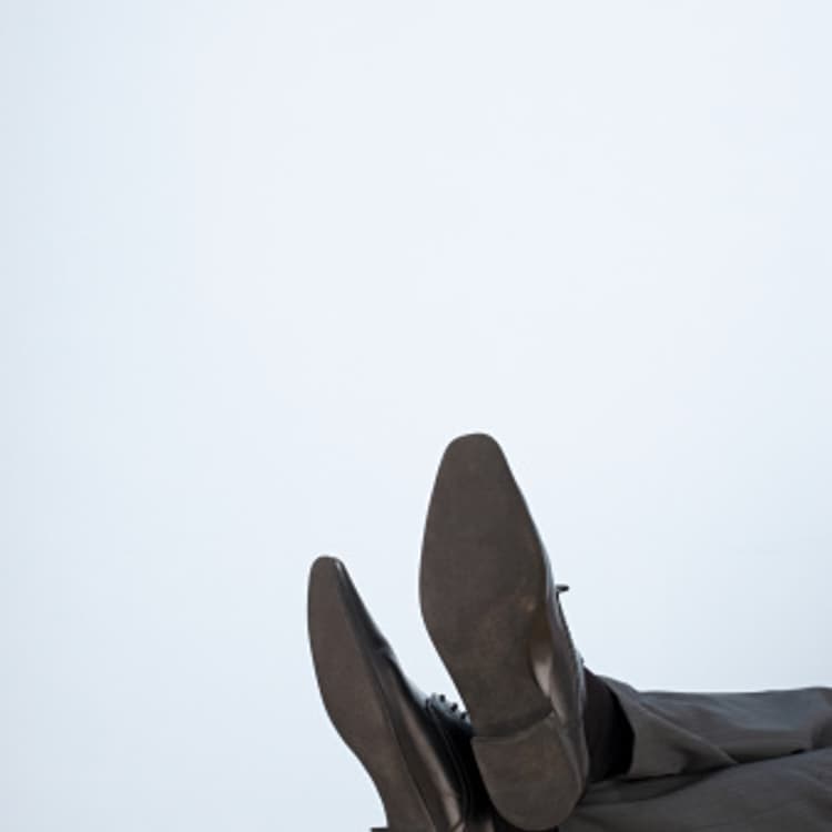 businessman-feet-desk