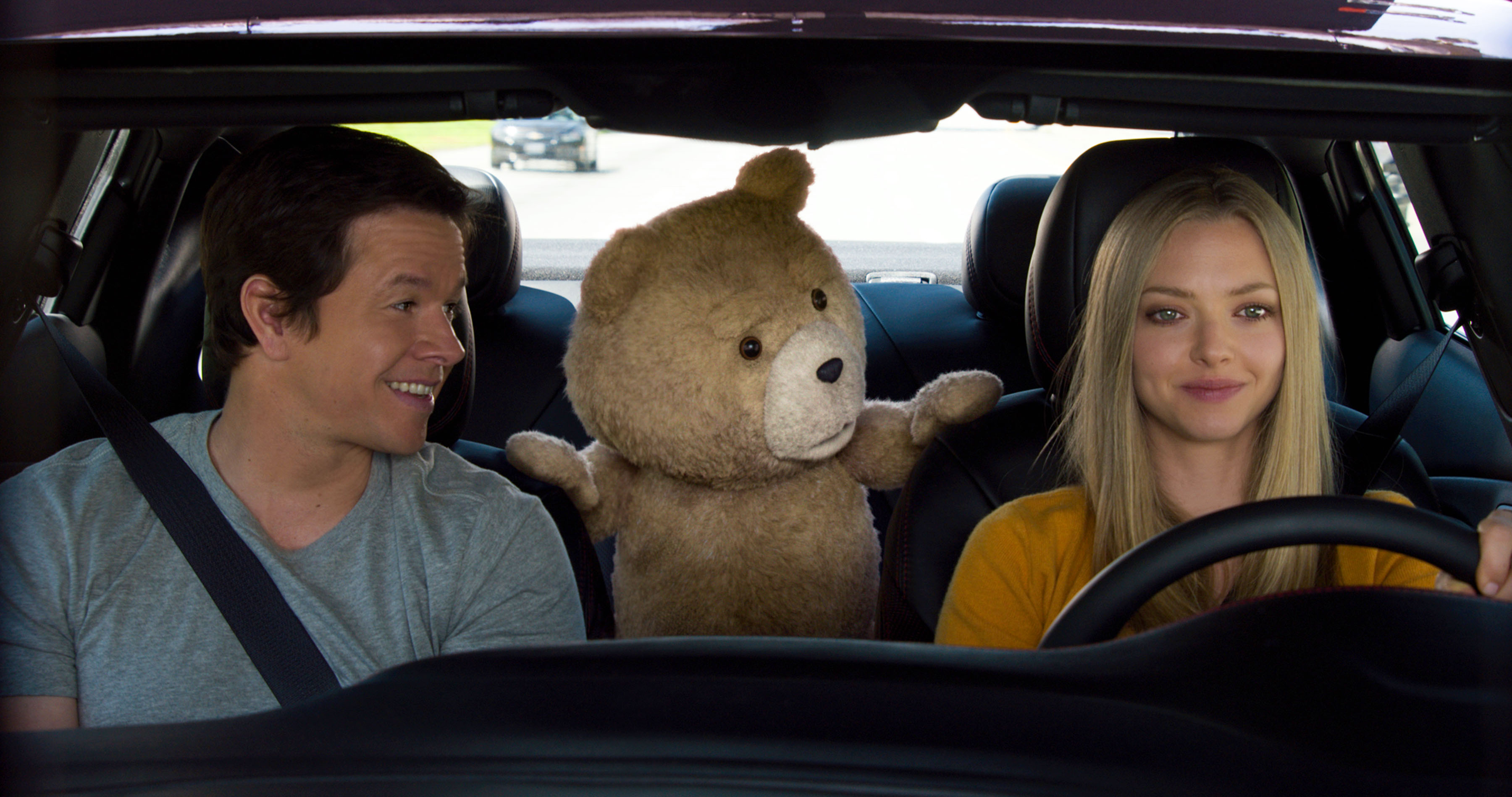 Mark Wahlberg (L) and Amanda Seyfried in a scene from "Ted 2."