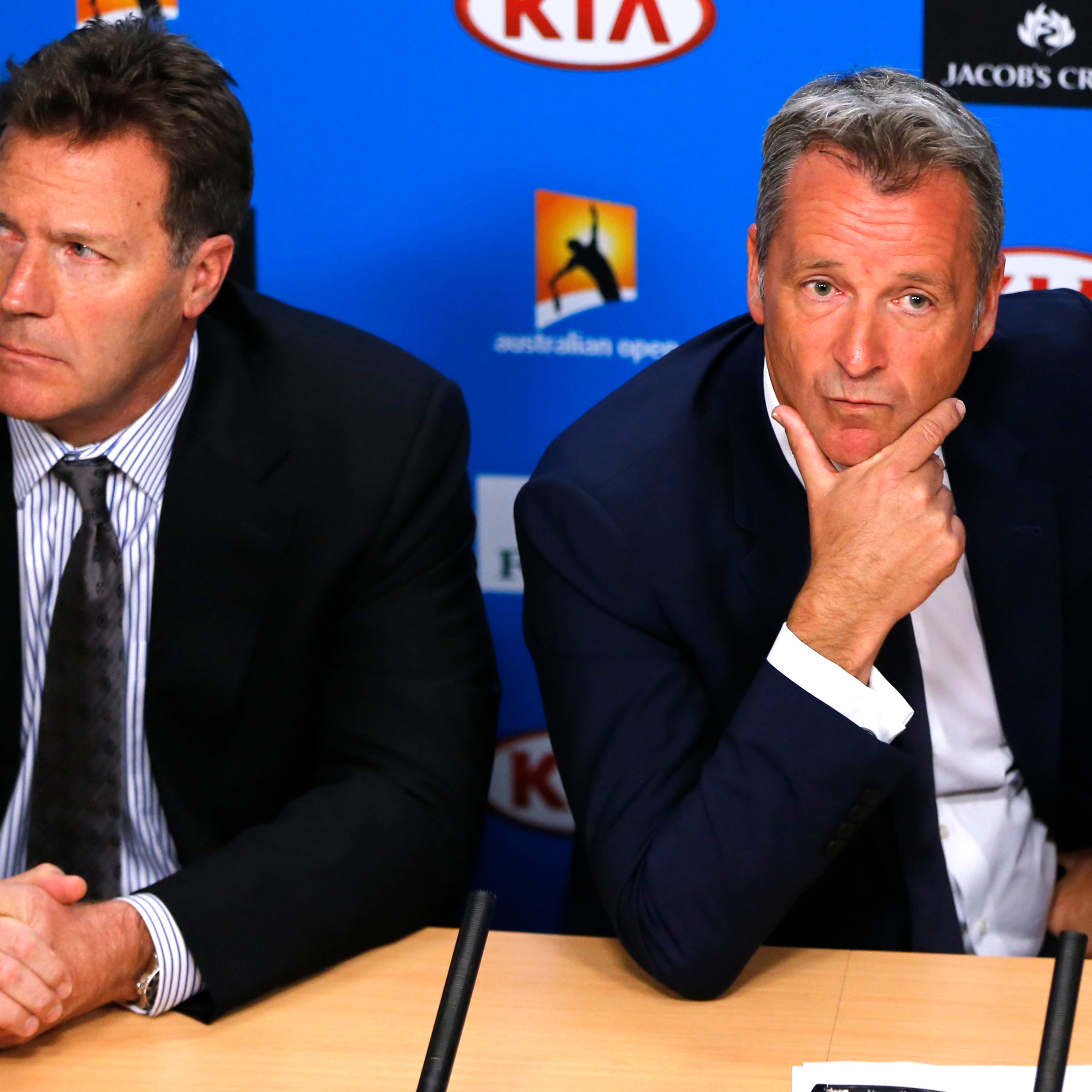 ATP chairman Chris Kermode and vice chairman Mark Young listen to reporter's question during a press conference at the Australian Open tennis championships in Melbourne, Australia on Jan. 18, 2016.