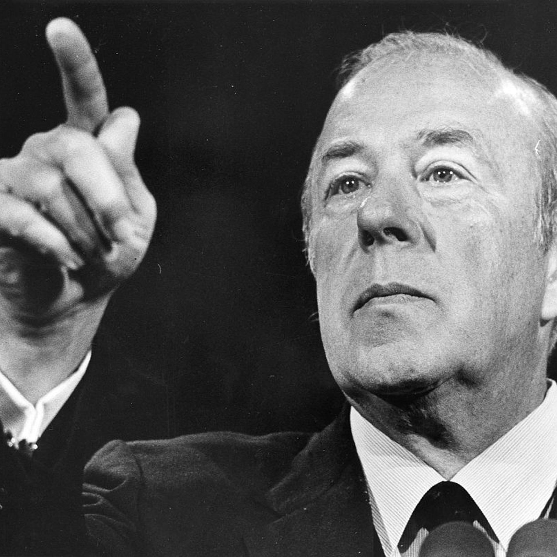 Secretary of State George Schultz speaking at a press conference