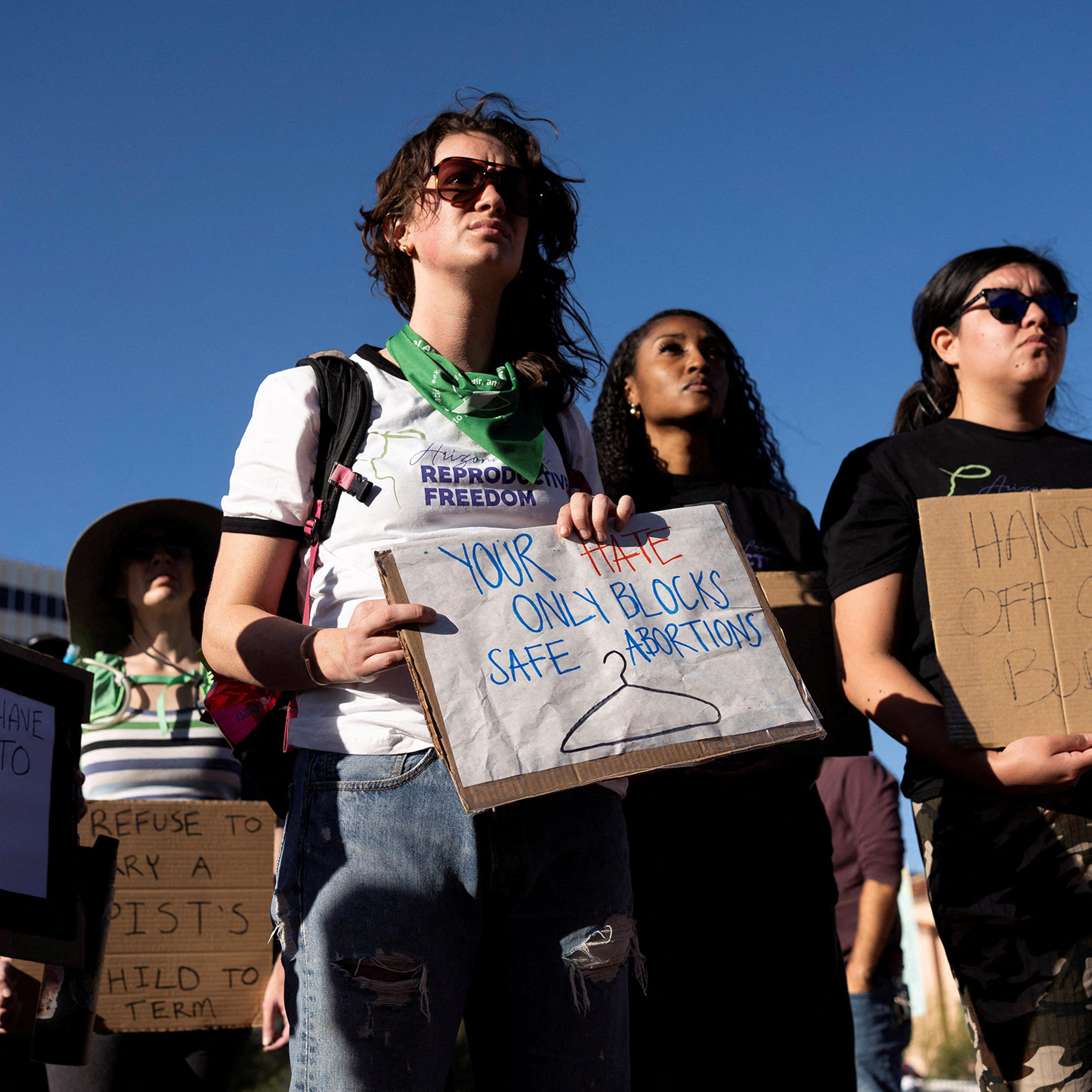 Protesters take part in a small rally led by Women's March Tucson after Arizona's Supreme Court revived a law dating to 1864 that bans abortion in virtually all instances, in Tucson, Ariz. on April 9, 2024.