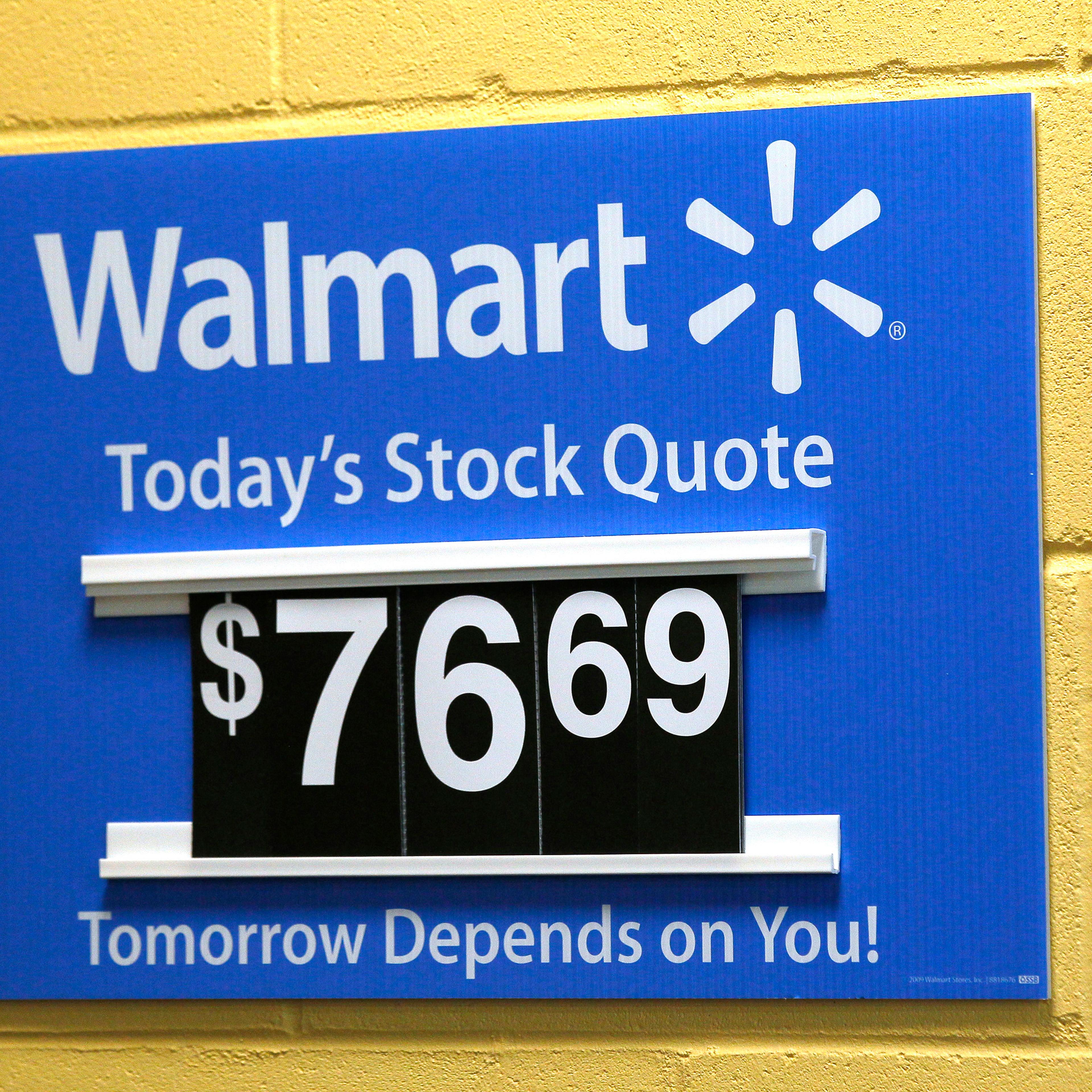 A sign lists the current Walmart stock price at a Walmart Supercenter in Bentonville