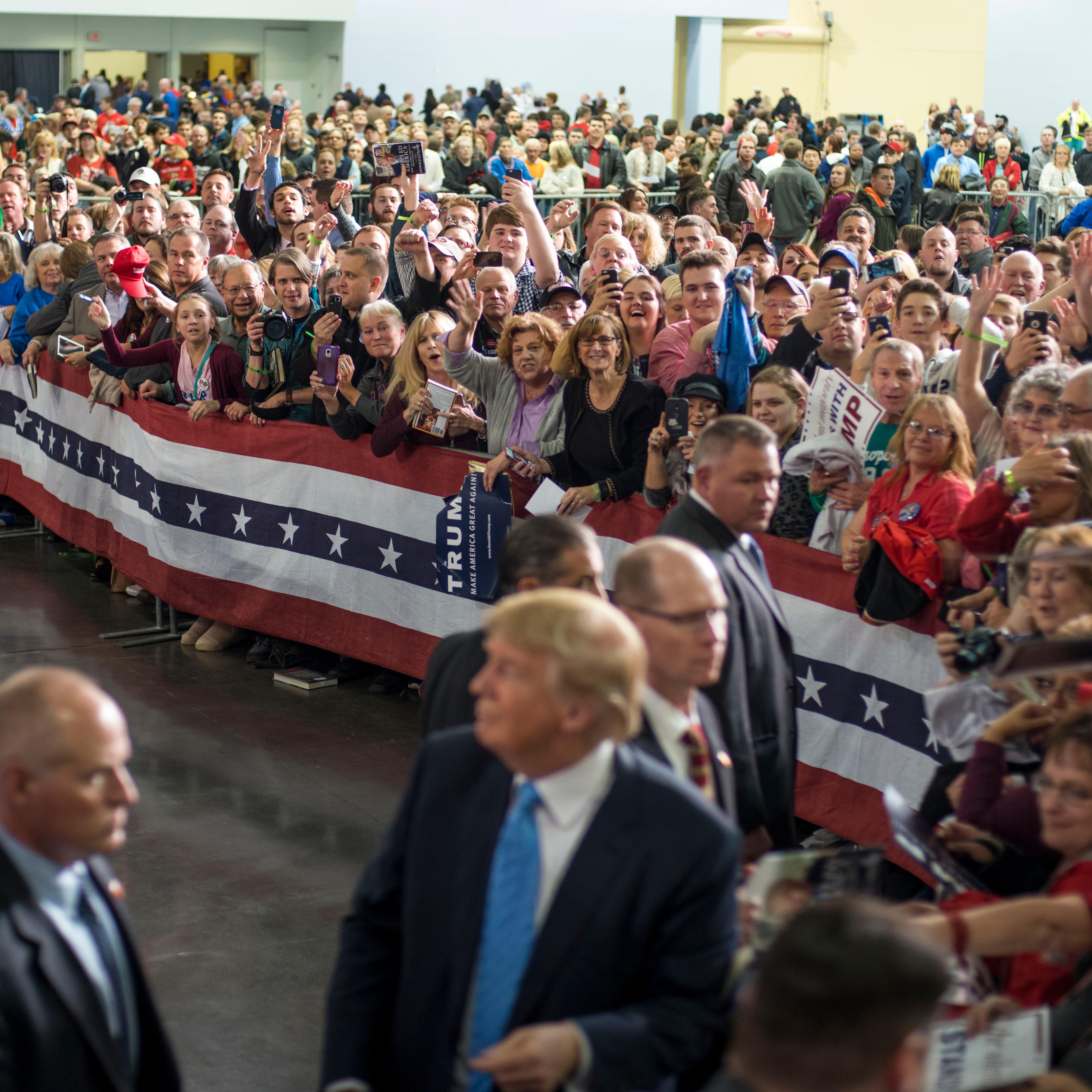Donald Trump shakes hands and signs autographs with his supporters on Nov. 23, 2015 in Columbus, OH.