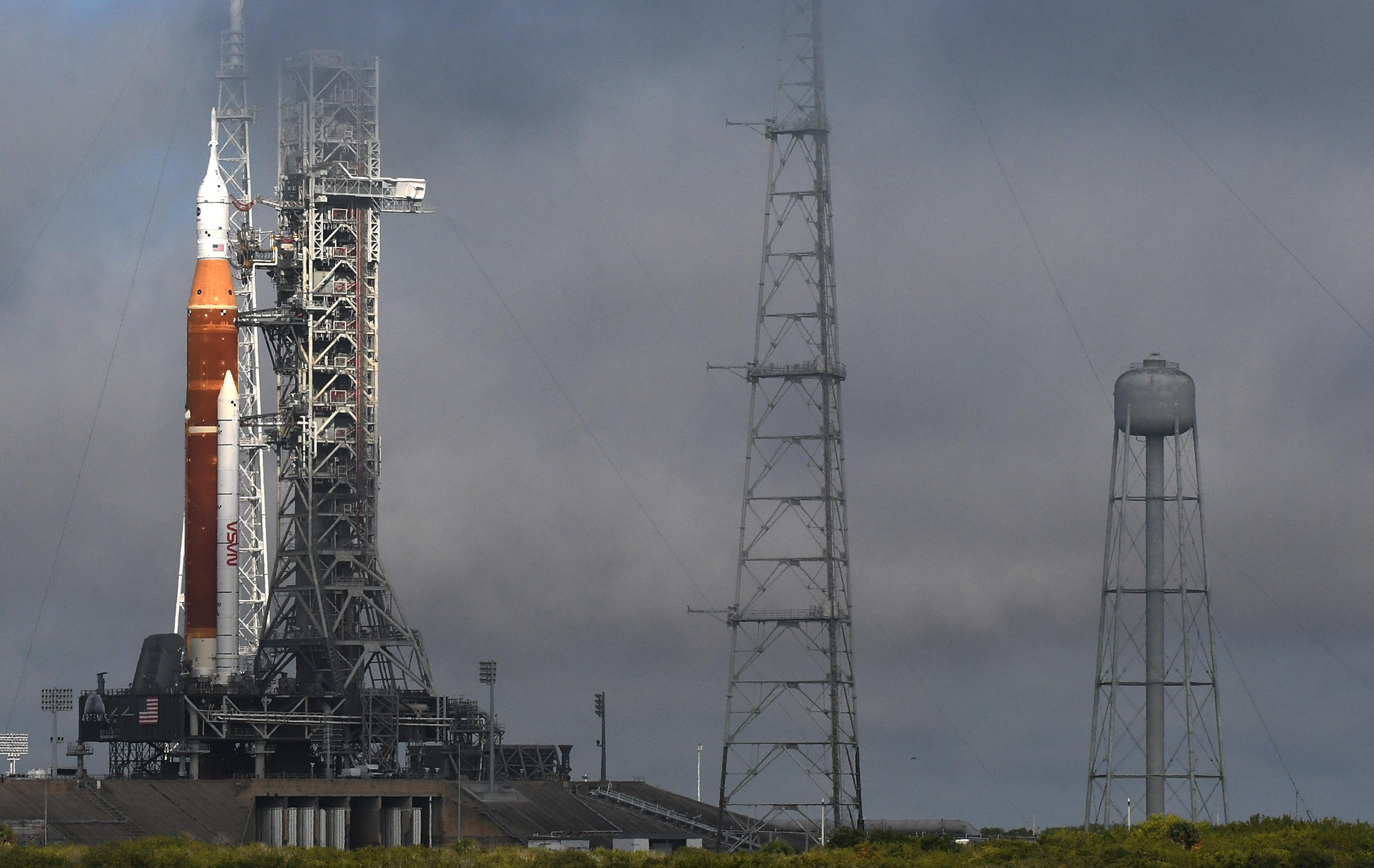 The SLS moon rocket topped by the Orion spacecraft stands at launch complex 39B following an overnight rollout from the Vehicle Assembly Building at the Kennedy Space Center in Cape Canaveral, Fla. on March 18, 2022.