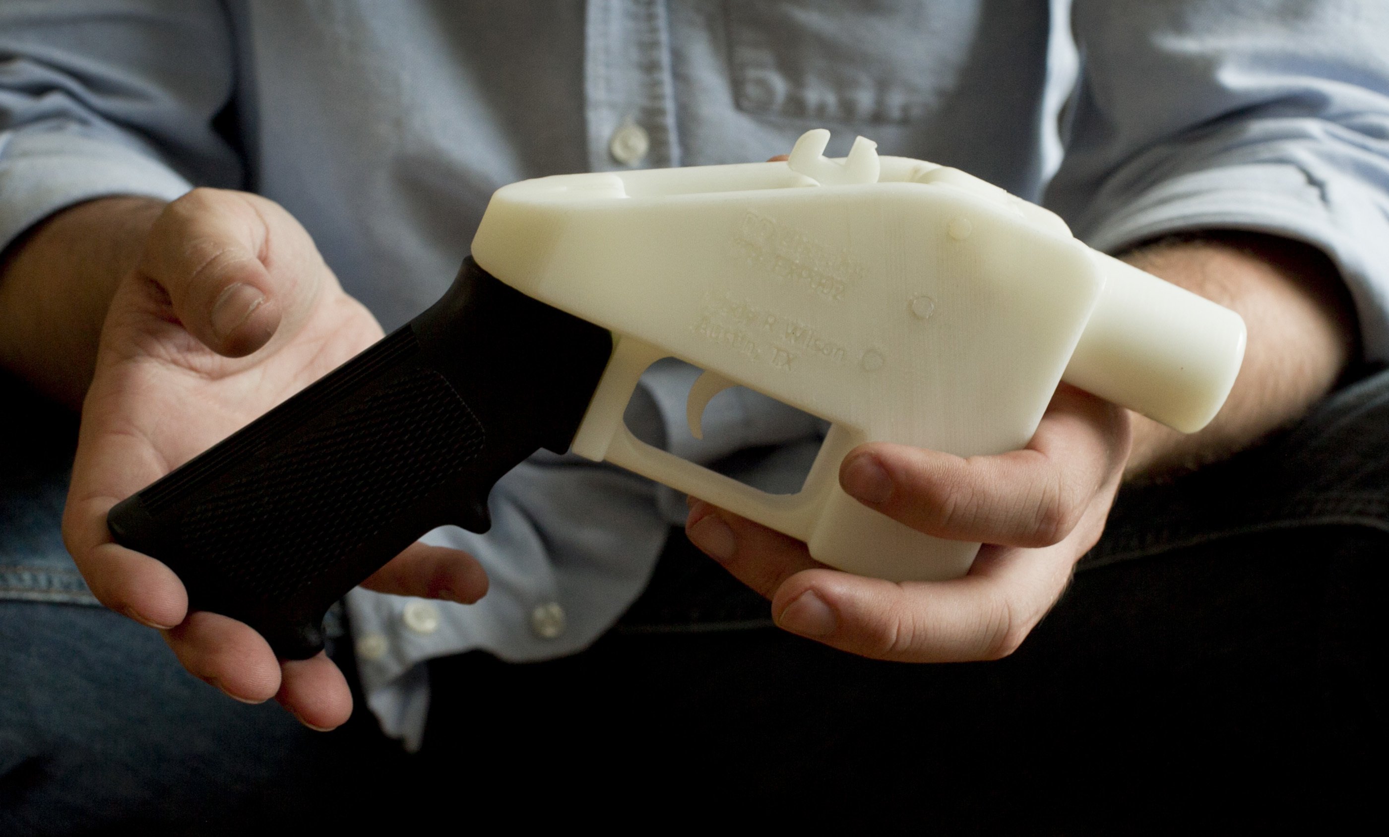 Cody Wilson holding 3D gun