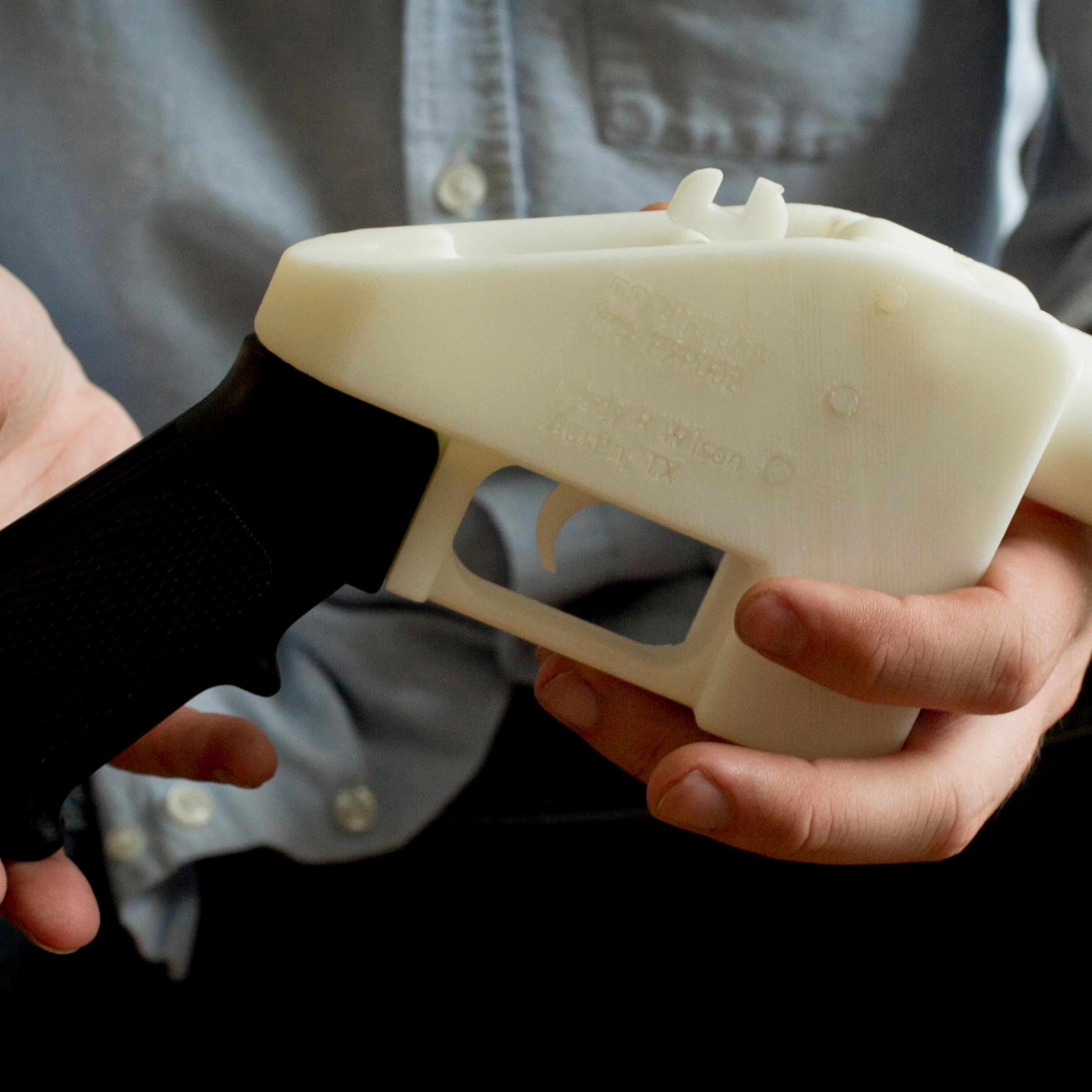 Cody Wilson holding 3D gun