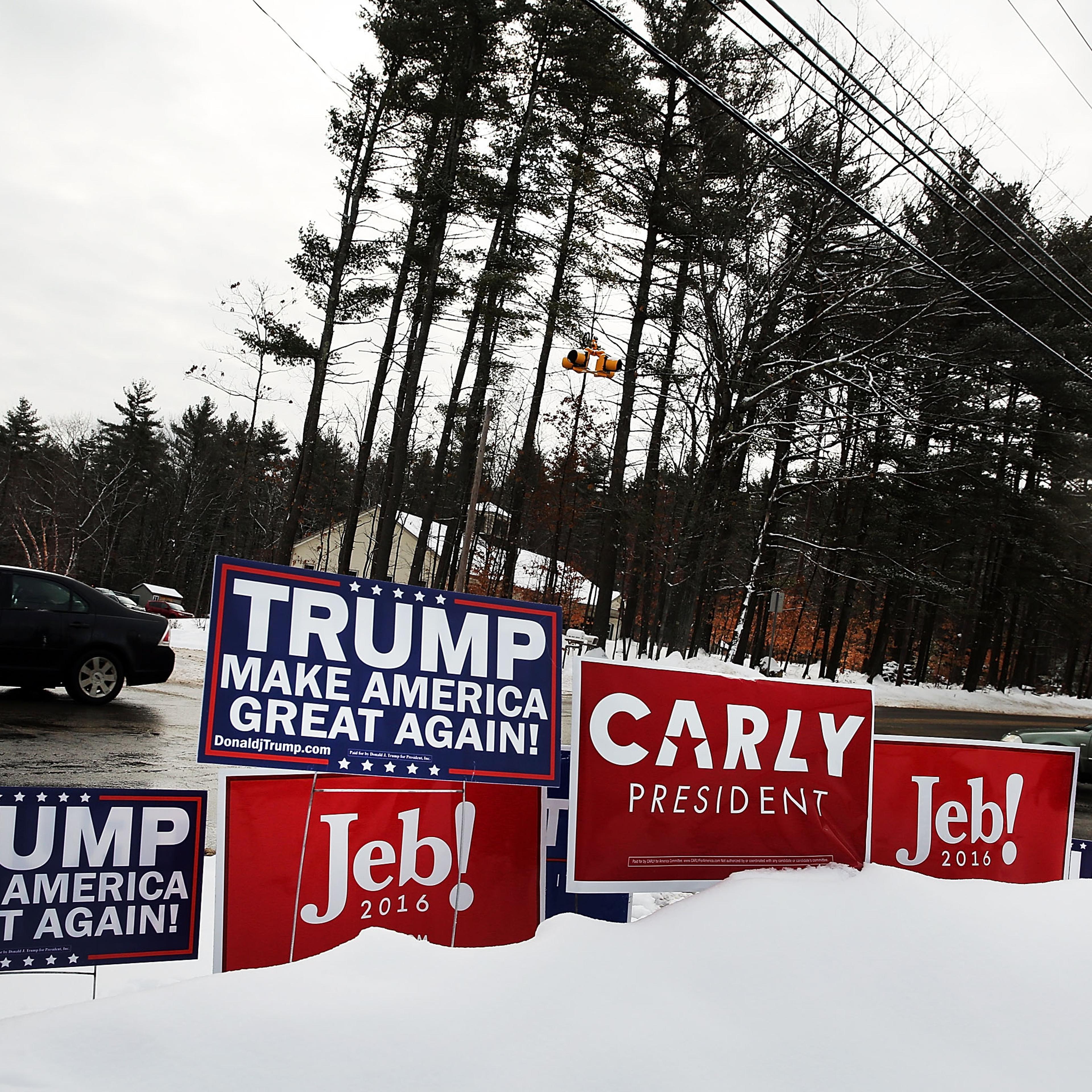 Candidate signs are displayed in front of a middle school serving as a voting station on the day of the New Hampshire Primary on February 9, 2016 in Bow, New Hampshire.