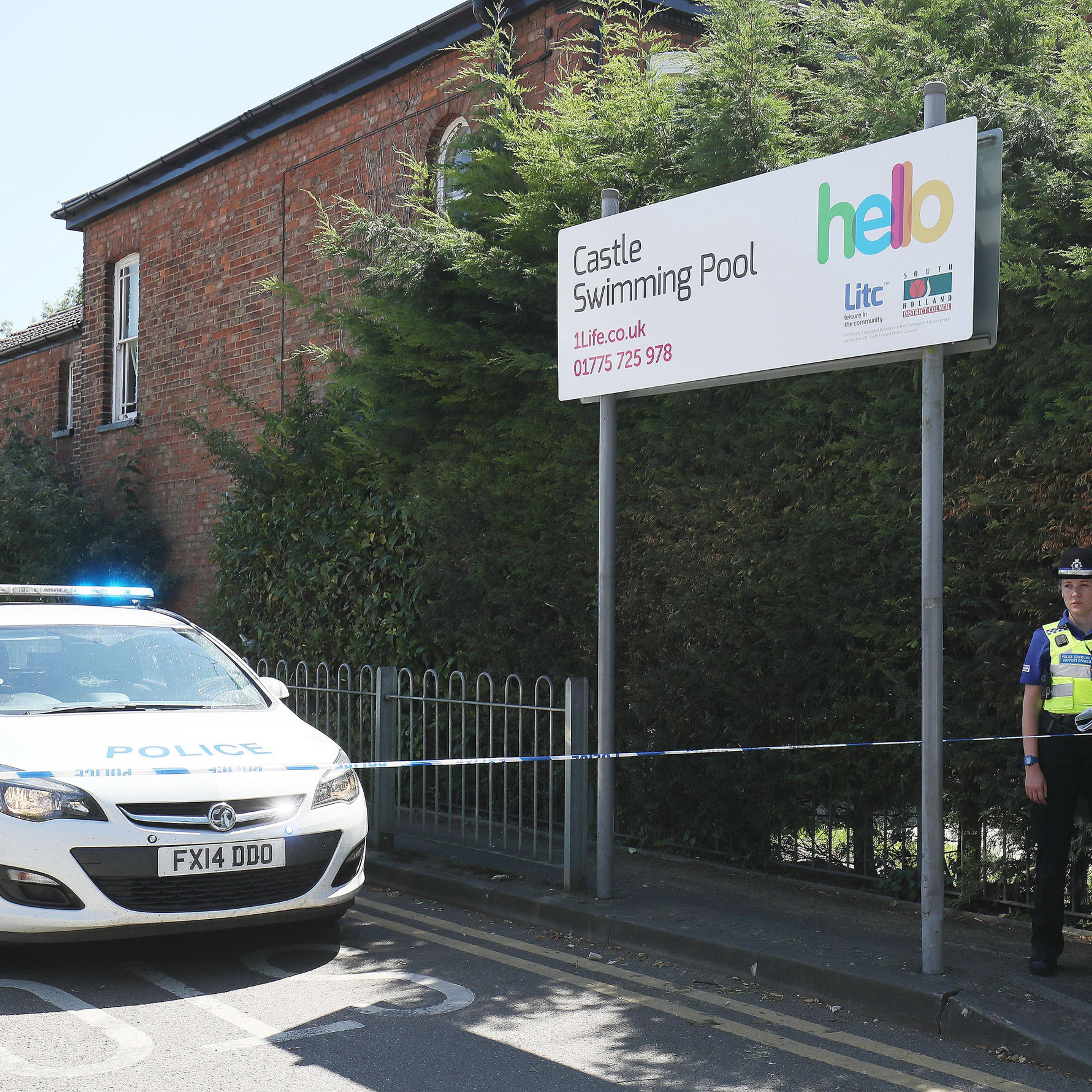 Emergency services at the scene near Castle Swimming Pool after three people including a suspected gunman have been shot dead in Spalding, Lincolnshire on July 19, 2016.