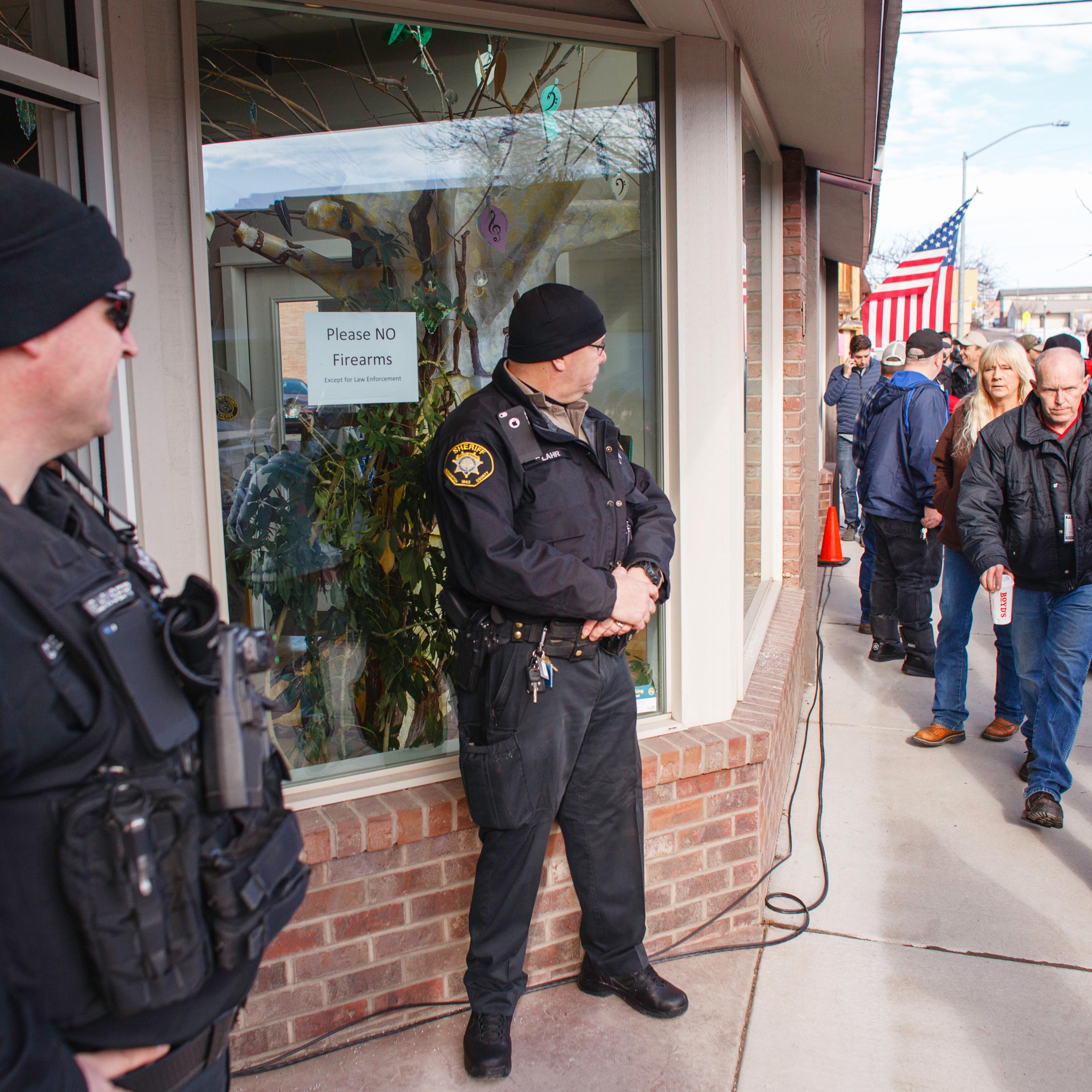 Washington County Sheriff Deputies monitor the public outside of the Harney County Chamber of Commerce where a press conference was being held in Burns, Oregon, on Jan. 27, 2016.
