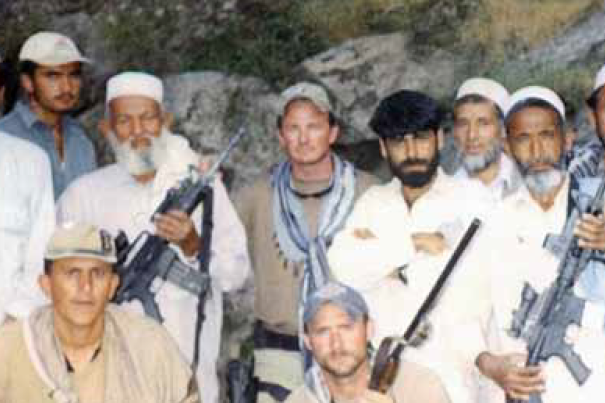 Major Jim Gant, center, with local Afghans and his soldiers in Afghanistan.