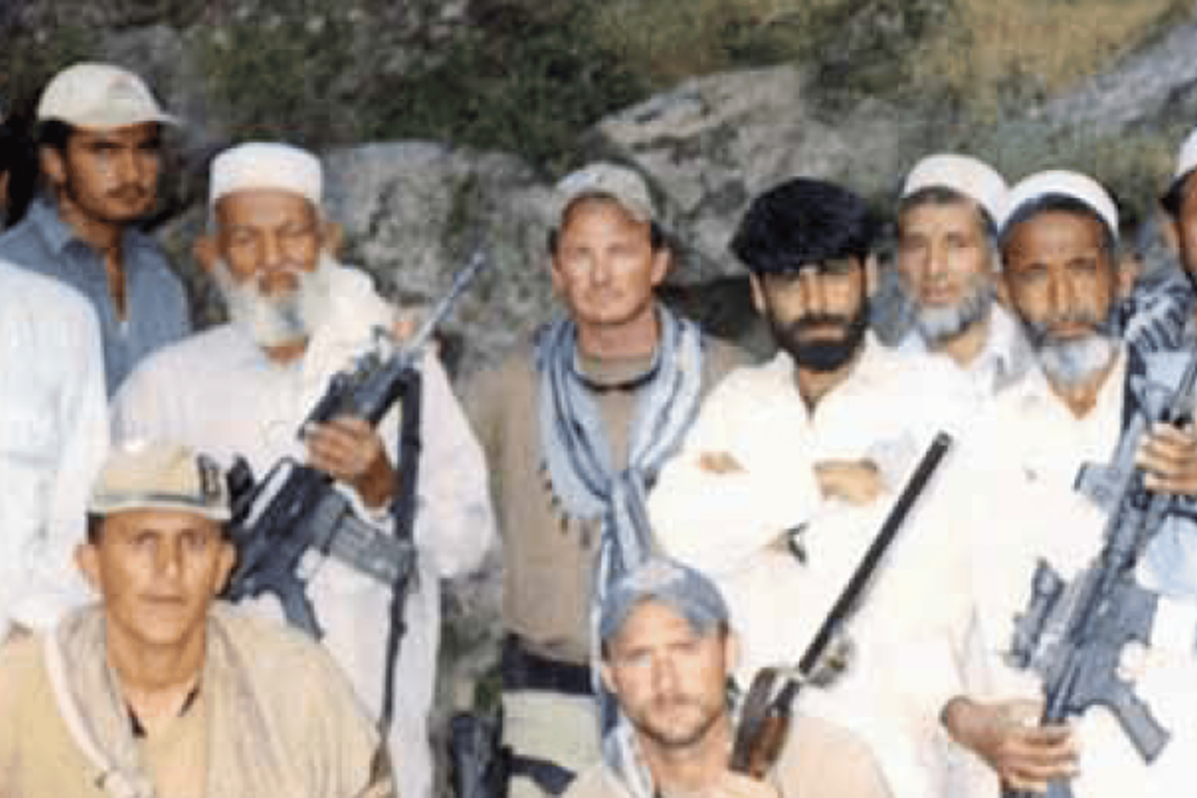 Major Jim Gant, center, with local Afghans and his soldiers in Afghanistan.