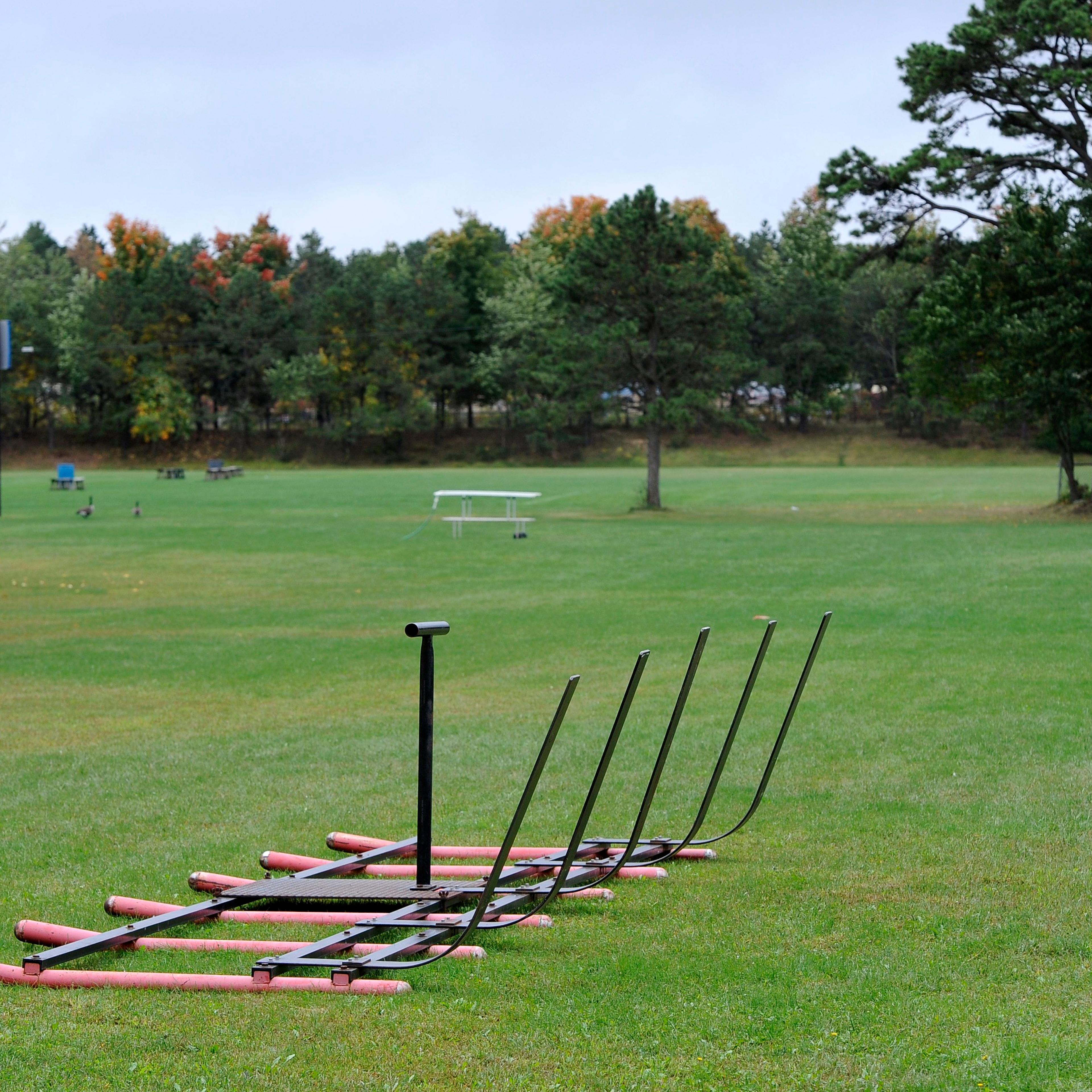 Equipment sits on a football practice field near the main entrance for Shoreham-Wading River High School on Oct. 2, 2014, in Shoreham, N.Y.
