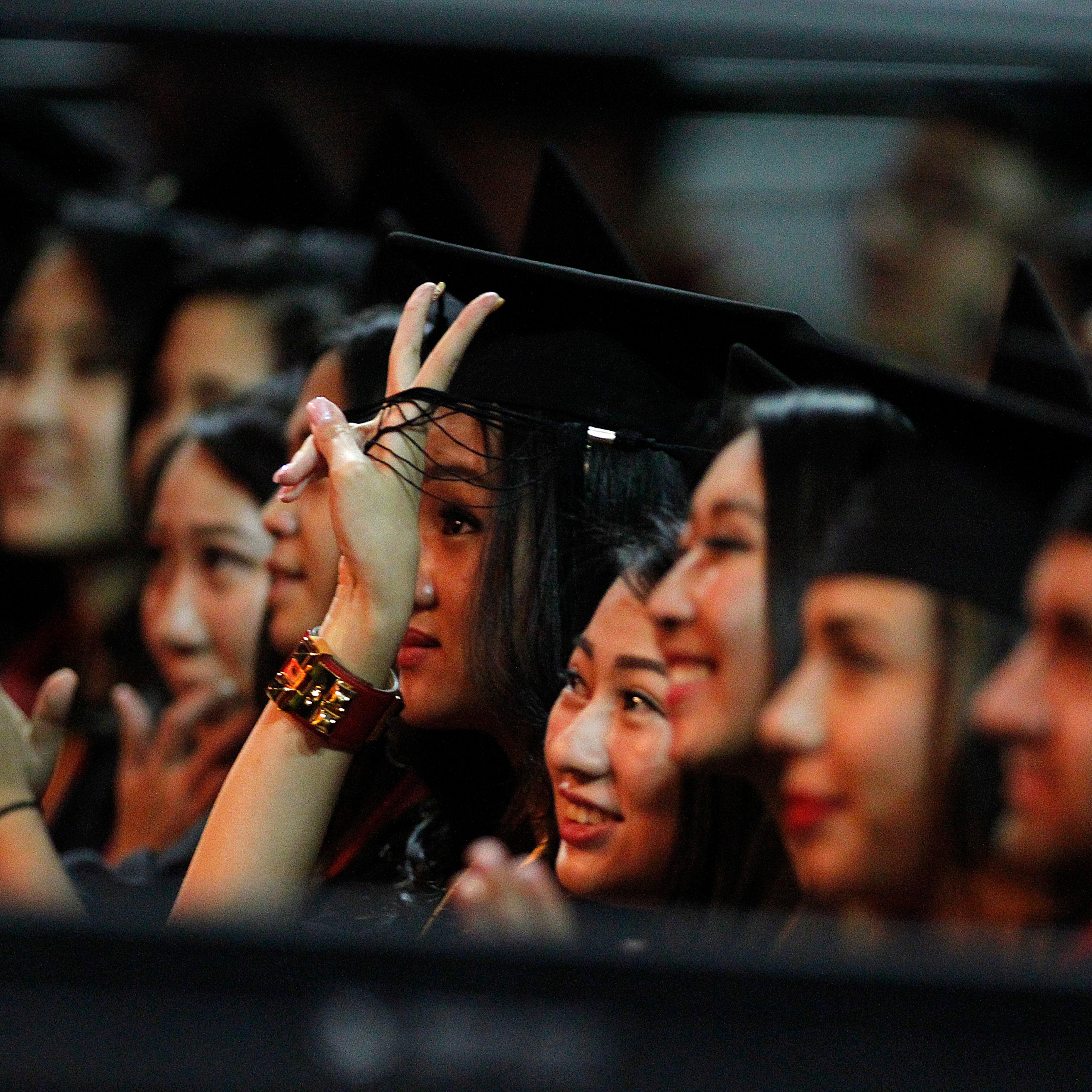 LOS ANGELES, CA.-MAY 16, 2014: USC Marshall School of Business graduates cheer after listening to t