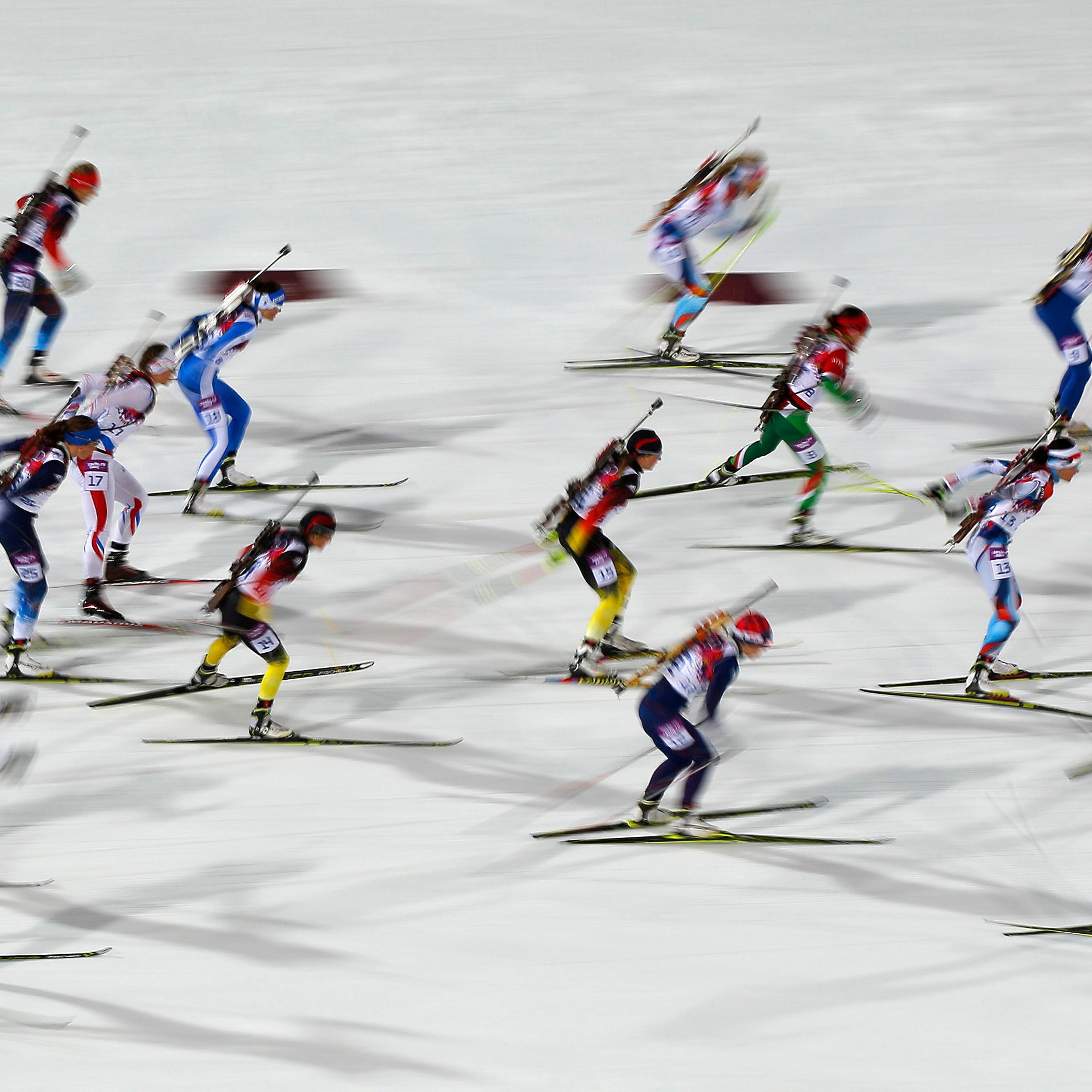Skiers compete during the women's biathlon 12.5km mass start event.